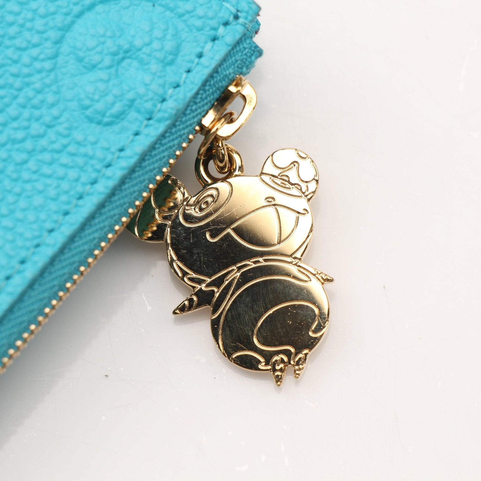 Louis Vuitton x Takashi Murakami compact wallet by Gold & Beyond with colorful floral design and Louis Vuitton branding.