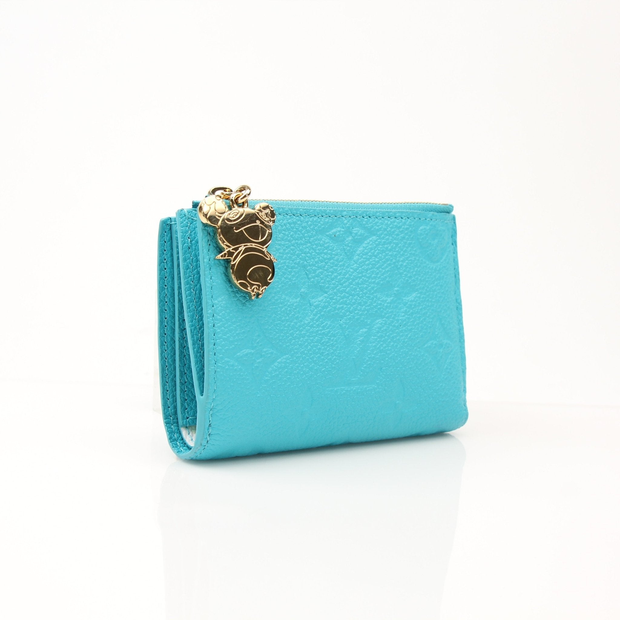 Louis Vuitton x Takashi Murakami compact wallet with colorful floral design, gold hardware, and textured leather details.
