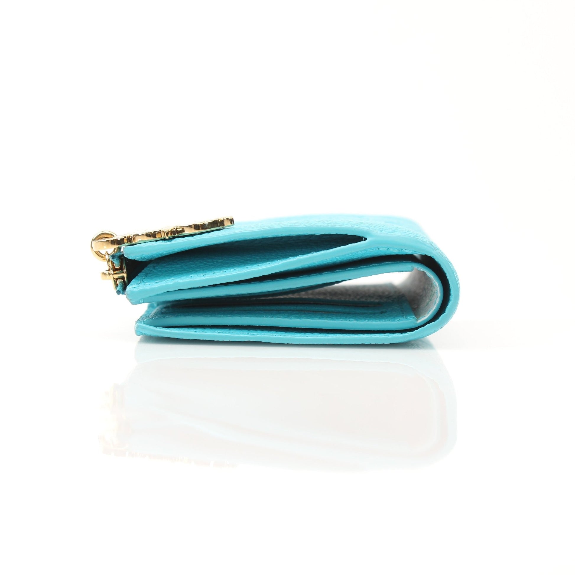 Louis Vuitton x Takashi Murakami compact wallet with colorful floral design and gold accents, crafted by Gold & Beyond.