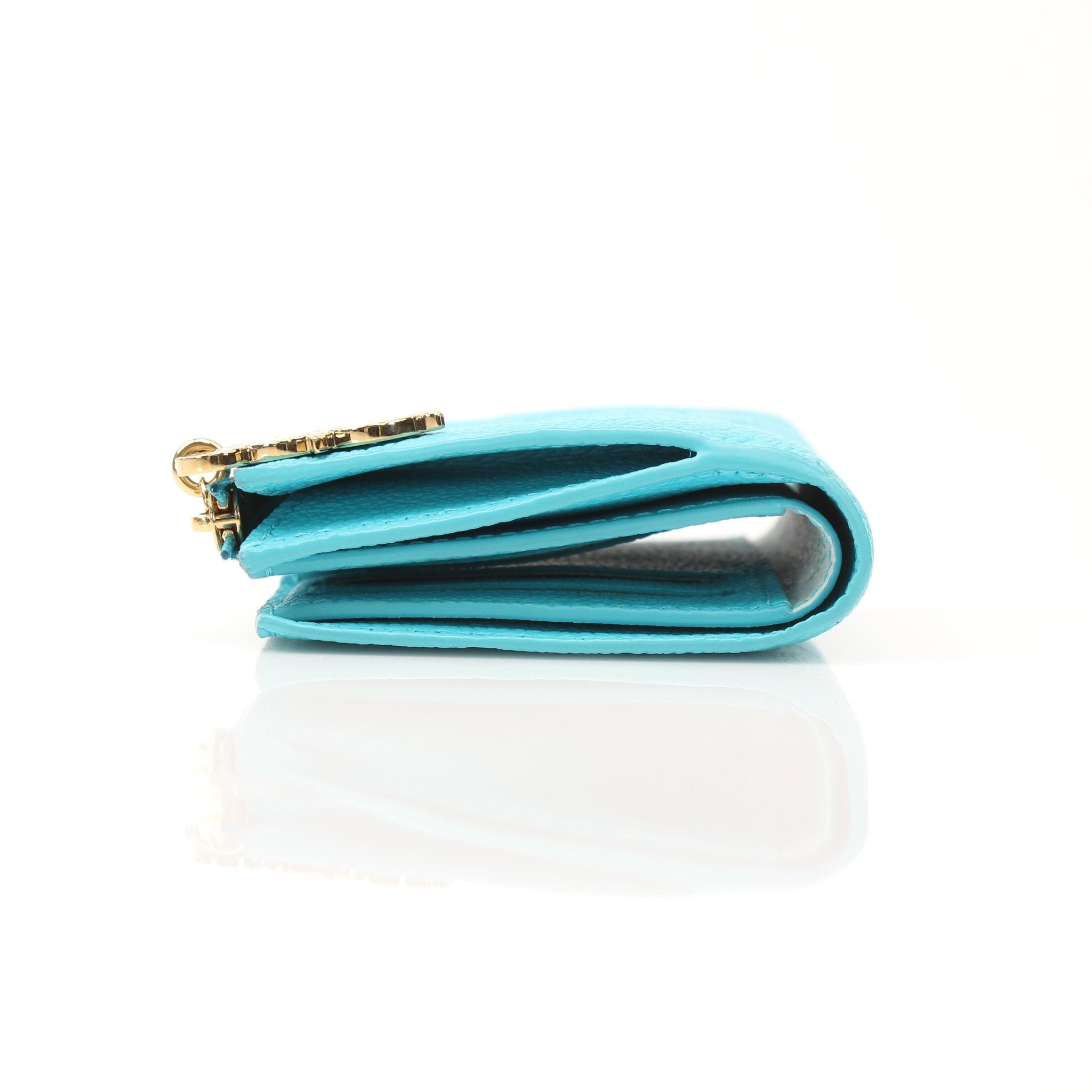 Louis Vuitton x Takashi Murakami compact wallet with colorful floral design and gold accents, crafted by Gold & Beyond.