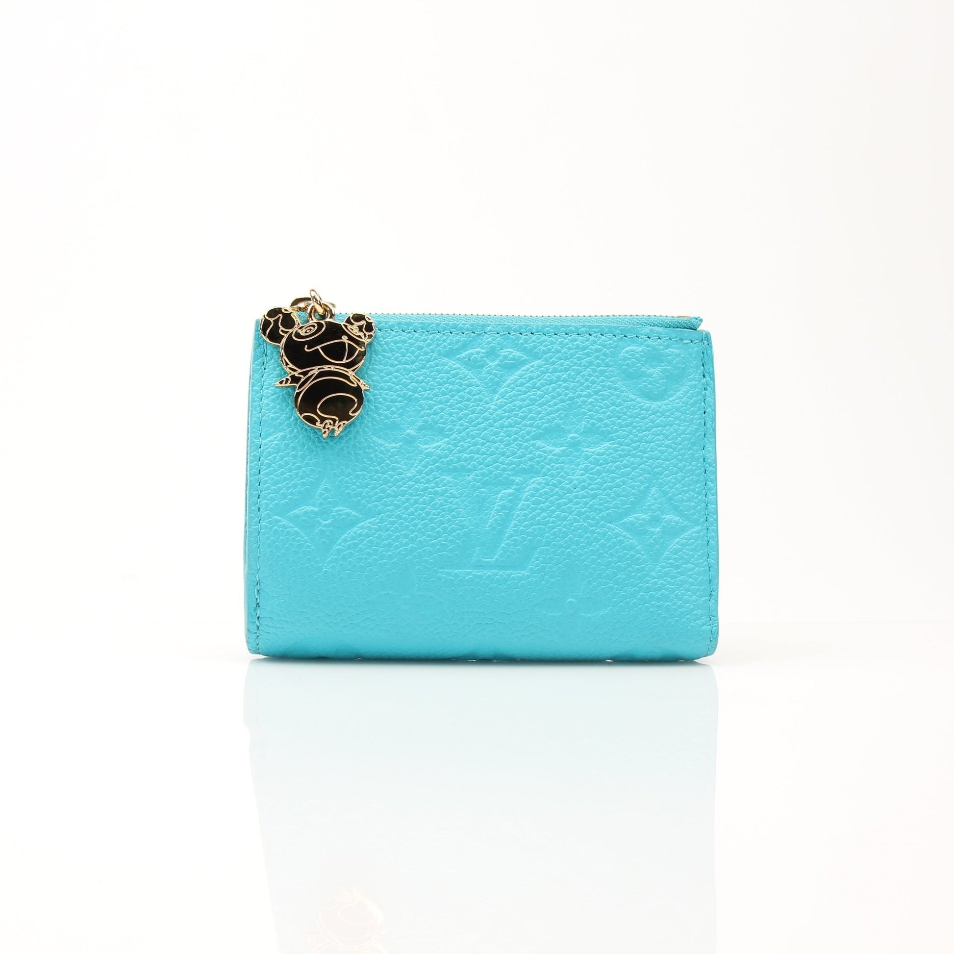 Louis Vuitton x Takashi Murakami compact wallet with colorful floral design, featuring gold accents and a sleek, stylish look.