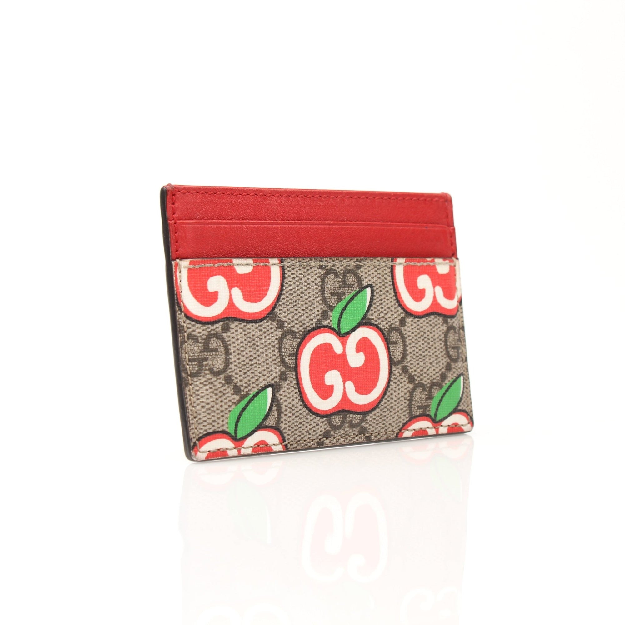 Gold & Beyond Gucci GG Supreme Apple Cardholder with multiple card slots and signature monogram design.