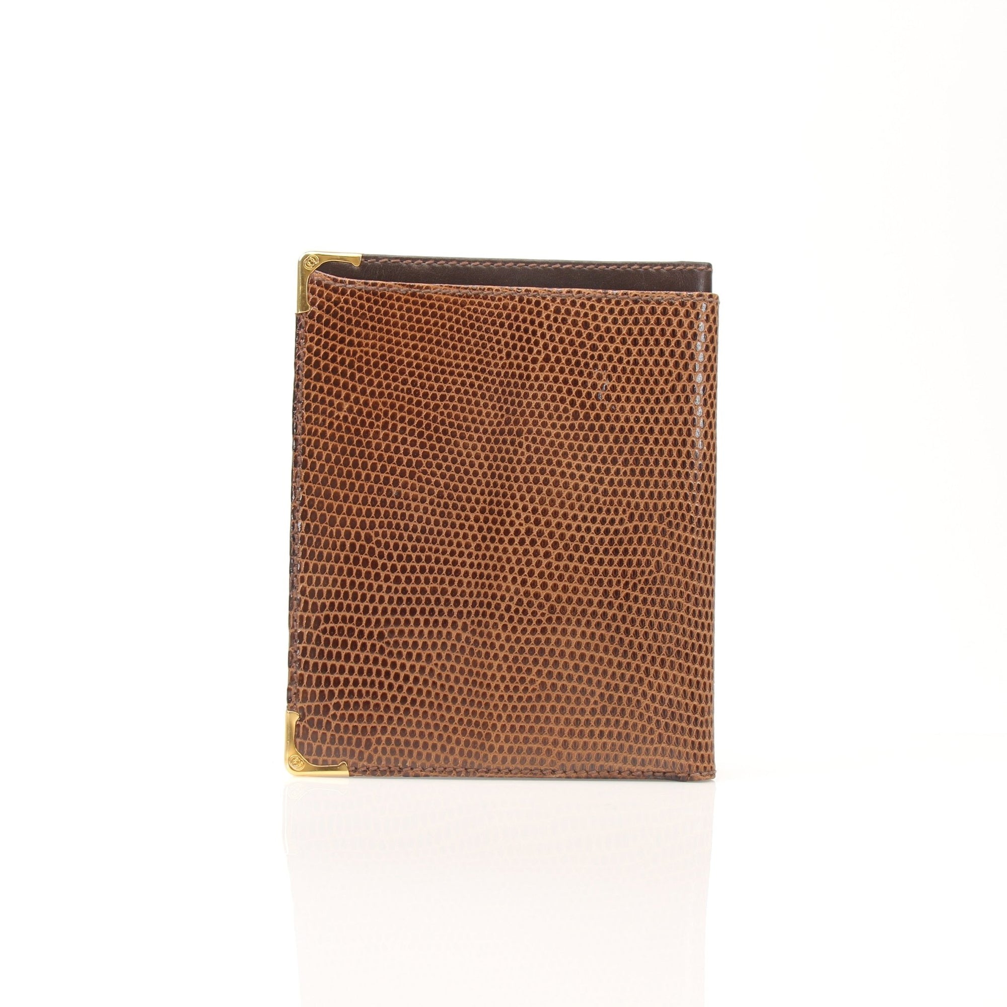Gucci vintage lizard embossed leather wallet with gold accents, featuring multiple card slots and classic design.