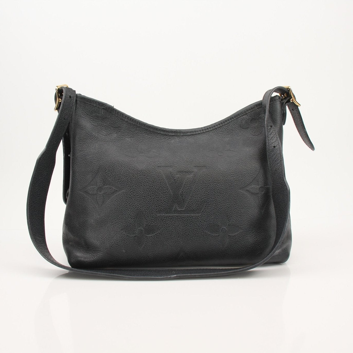 Louis Vuitton Carryall PM handbag with tan leather handles and monogram canvas, featuring a spacious interior and elegant design.