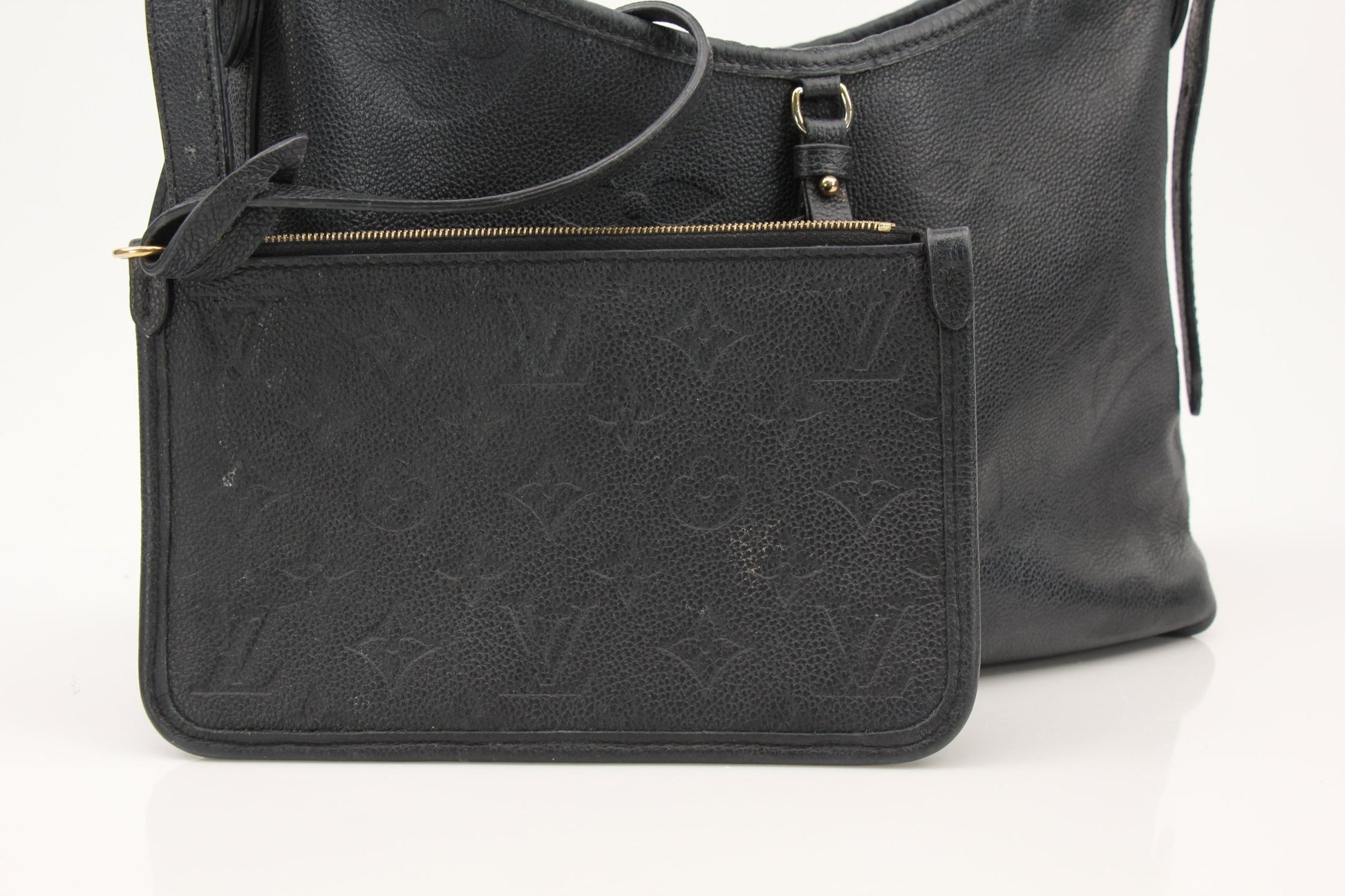 Louis Vuitton Carryall PM handbag by Gold & Beyond, showcasing sleek design and premium leather in a close-up image.