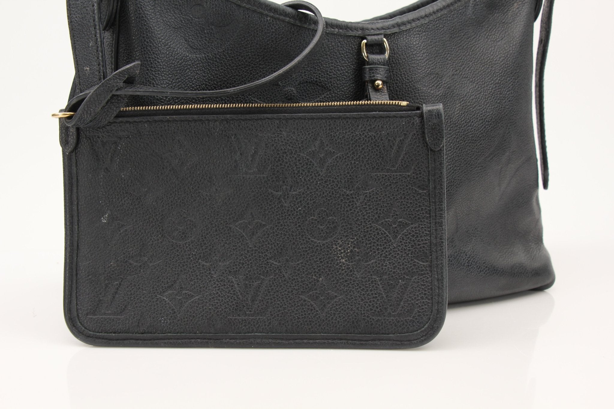 Louis Vuitton Carryall PM handbag by Gold & Beyond, showcasing sleek design and premium leather in a close-up image.