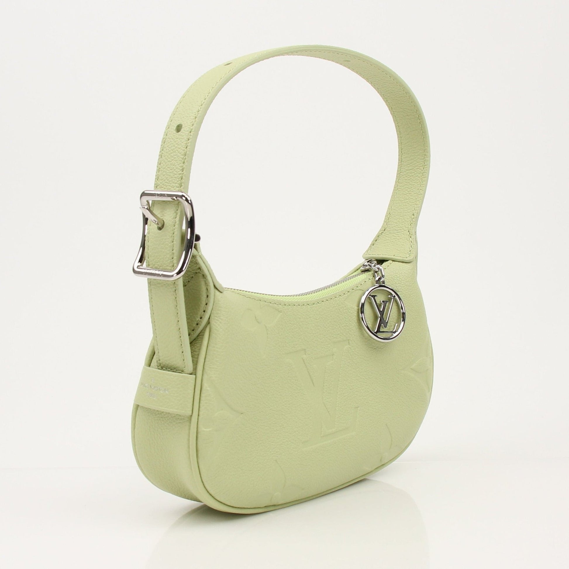 Gold & Beyond Louis Vuitton Mini Moon Bag handbag with gold-tone hardware and compact design, shown in a stylish image.