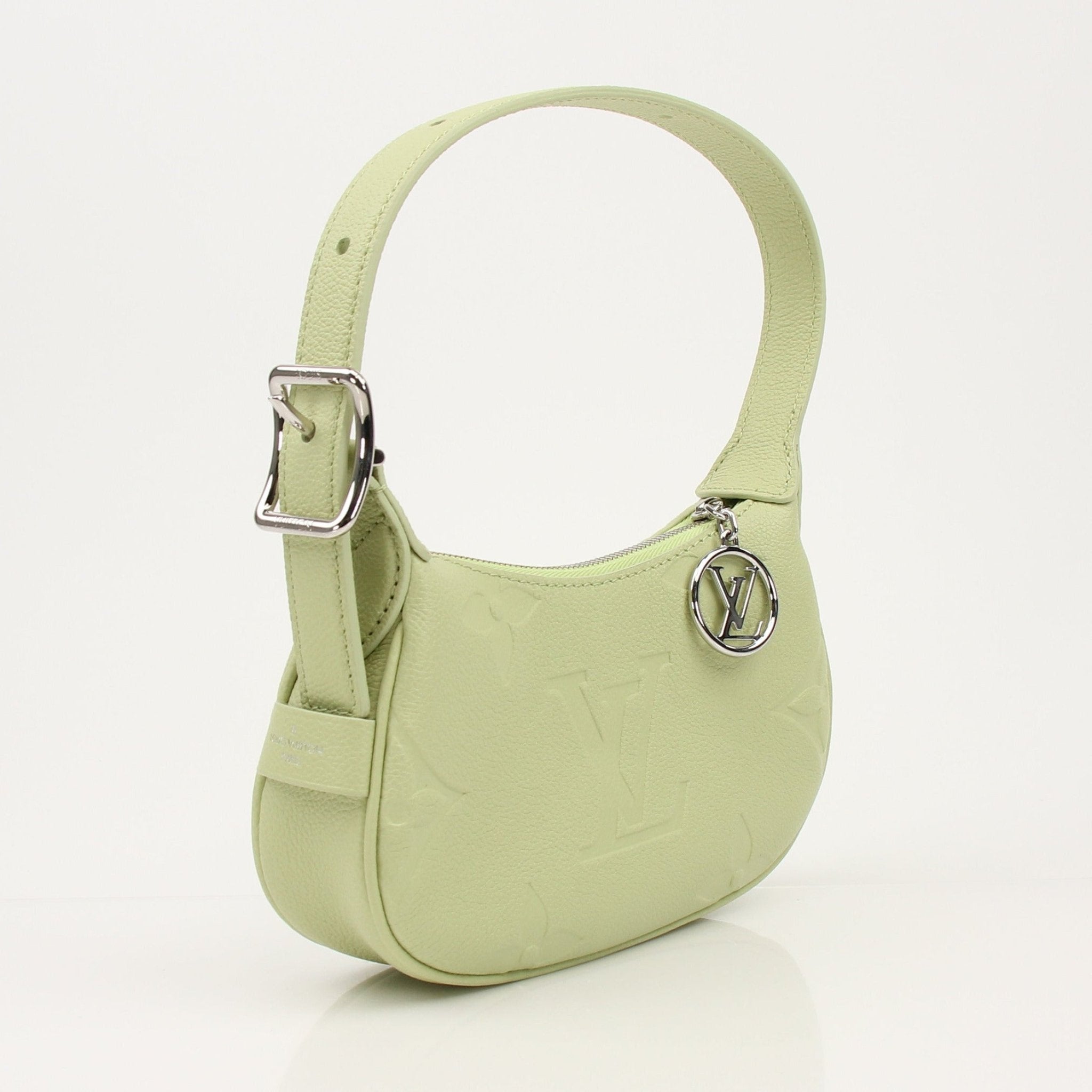 Gold & Beyond Louis Vuitton Mini Moon Bag handbag with gold-tone hardware and compact design, shown in a stylish image.