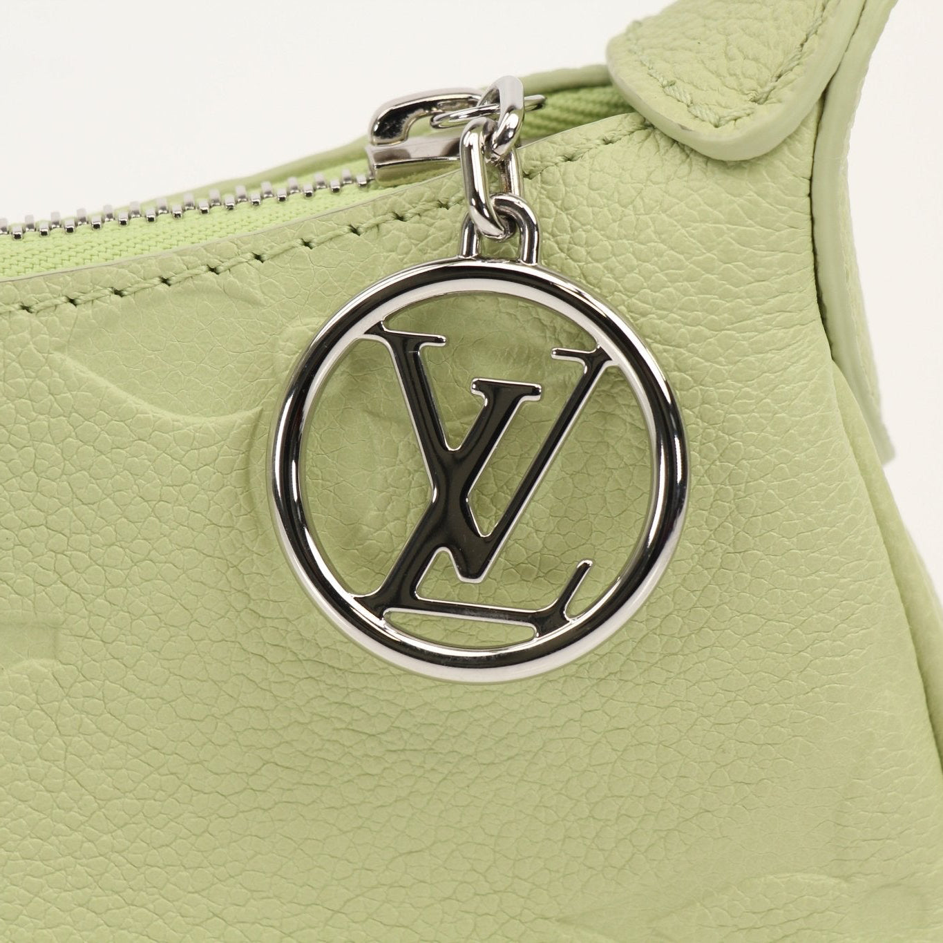 Gold & Beyond Louis Vuitton Mini Moon Bag handbag with gold-tone hardware and compact design, shown in the image.
