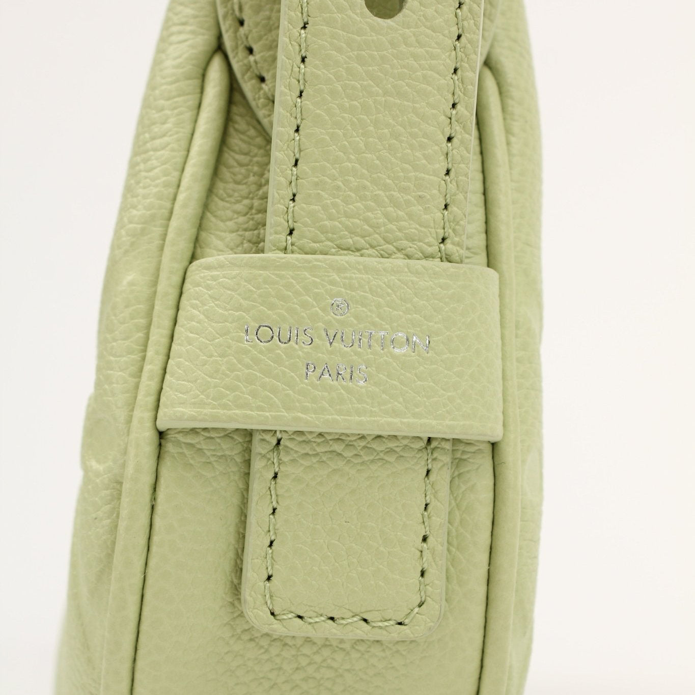 Gold & Beyond Louis Vuitton Mini Moon Bag handbag with gold hardware and compact design, shown in a stylish, close-up view.