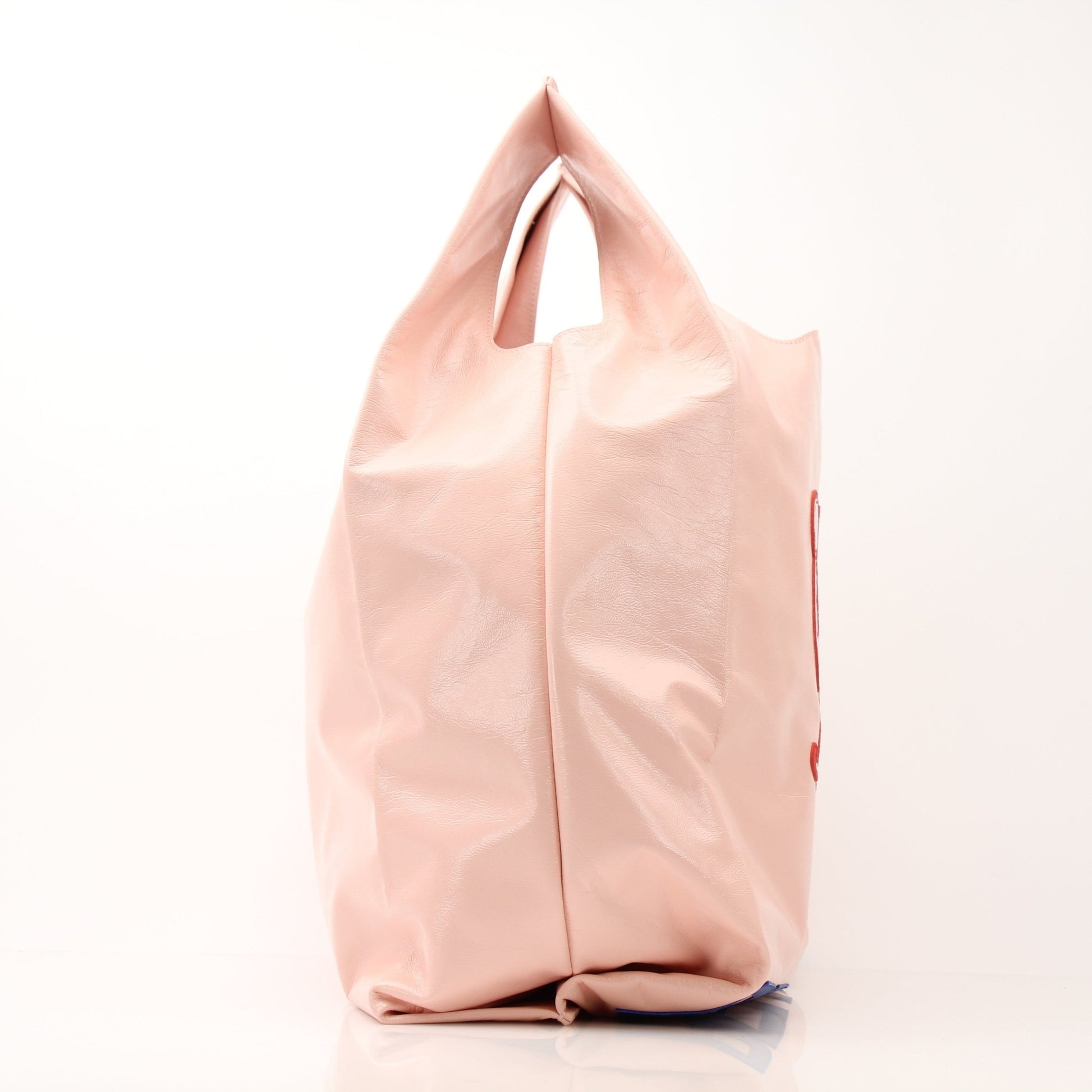 Pink Bottega Veneta Super Mercato Mermaid Tote Bag with gold accents, featuring a spacious handbag design and distinctive woven texture.