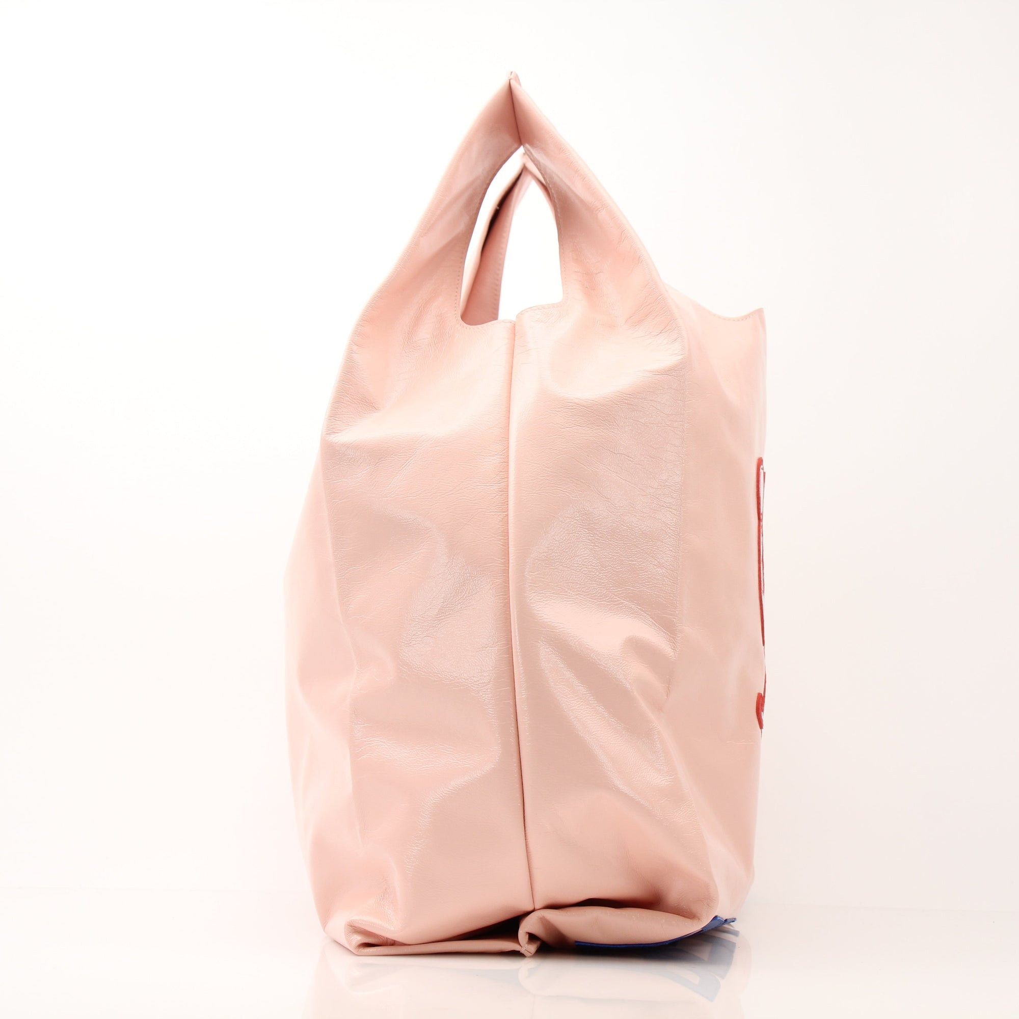 Pink Bottega Veneta Super Mercato Mermaid Tote Bag with gold handles, featuring a spacious design and stylish craftsmanship.