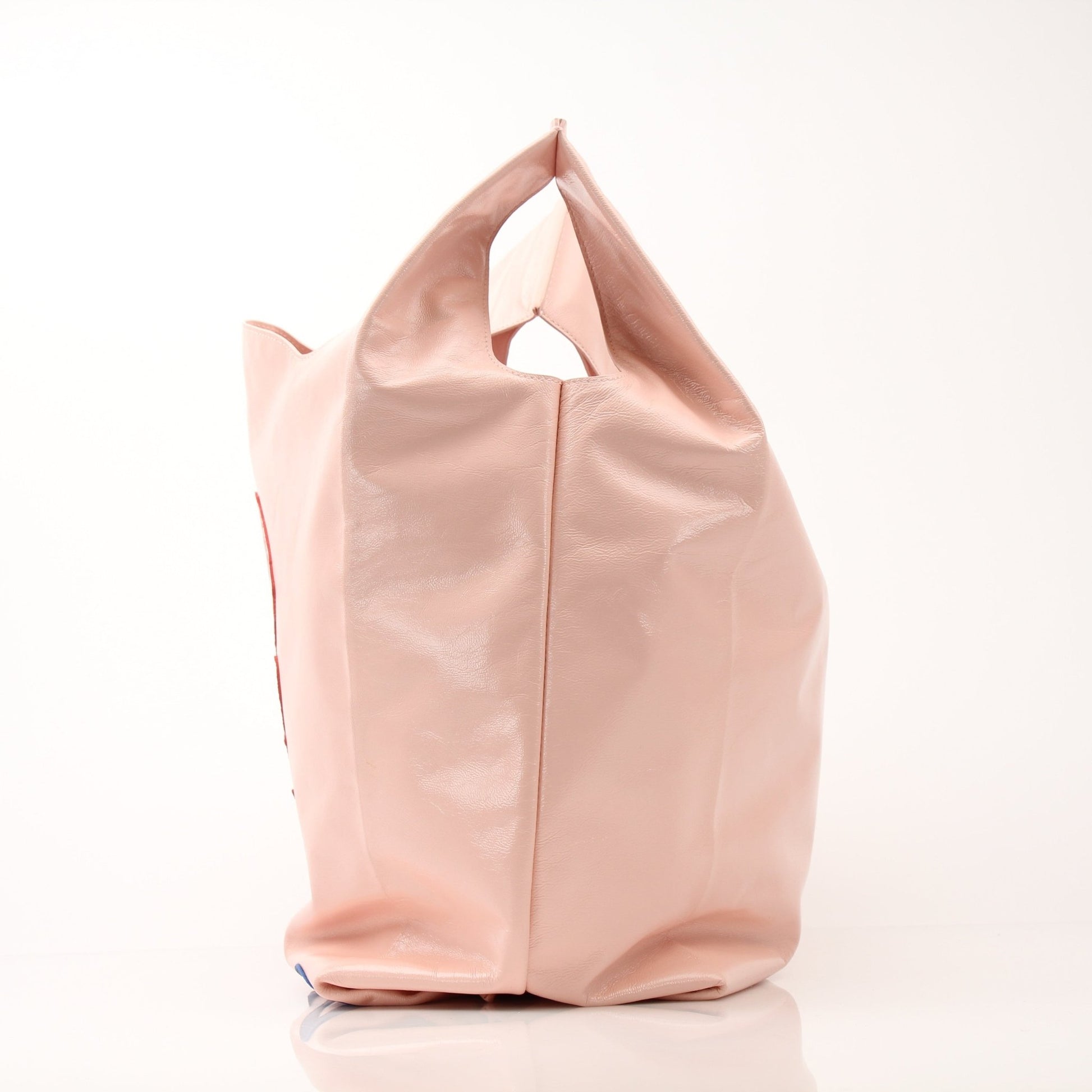 Bottega Veneta Super Mercato Pink Mermaid Tote Bag, a stylish handbag with vibrant pink color and textured design.