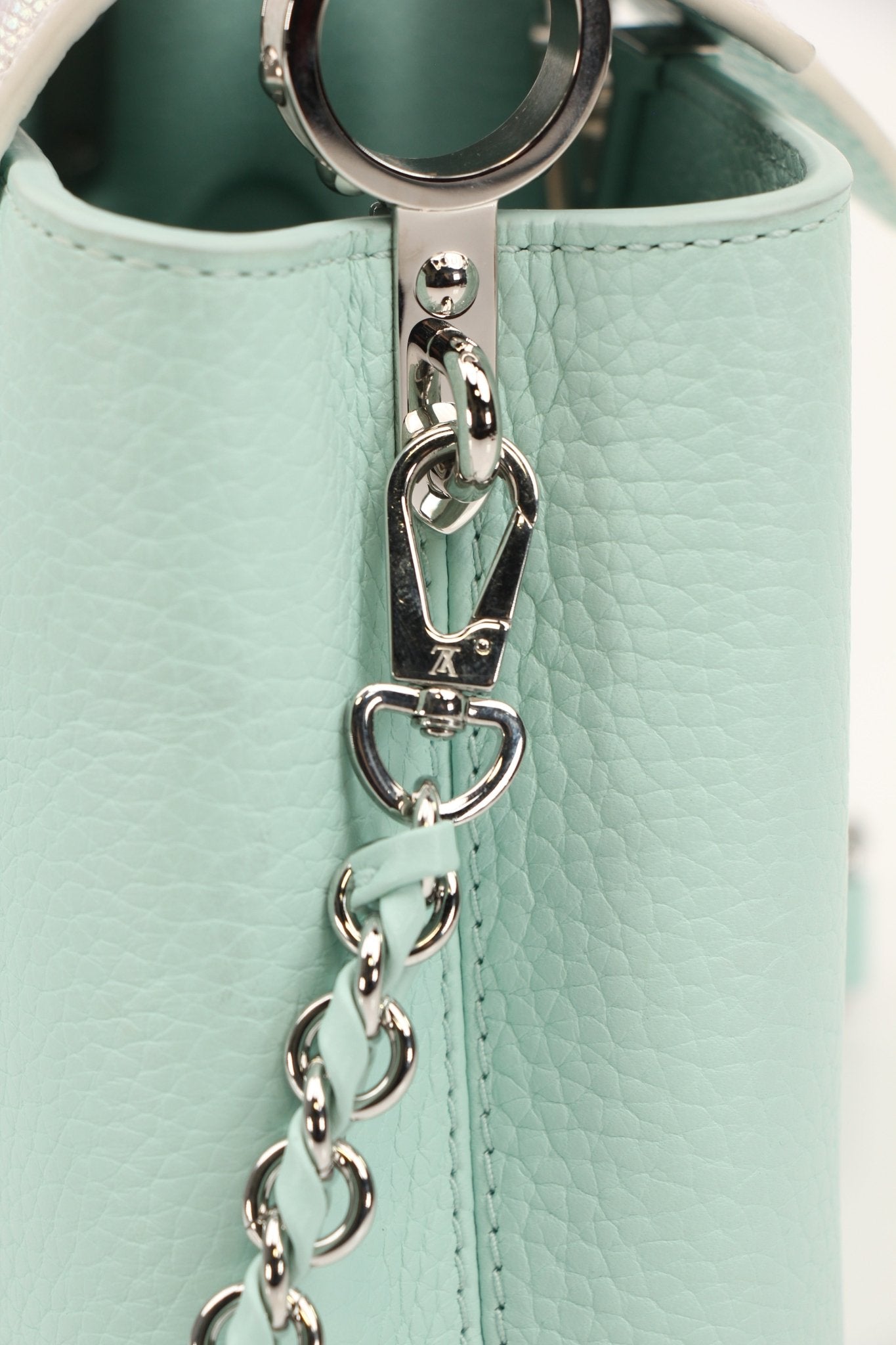 Louis Vuitton Capucines handbag in leather with structured design and top handle, featuring signature LV details.