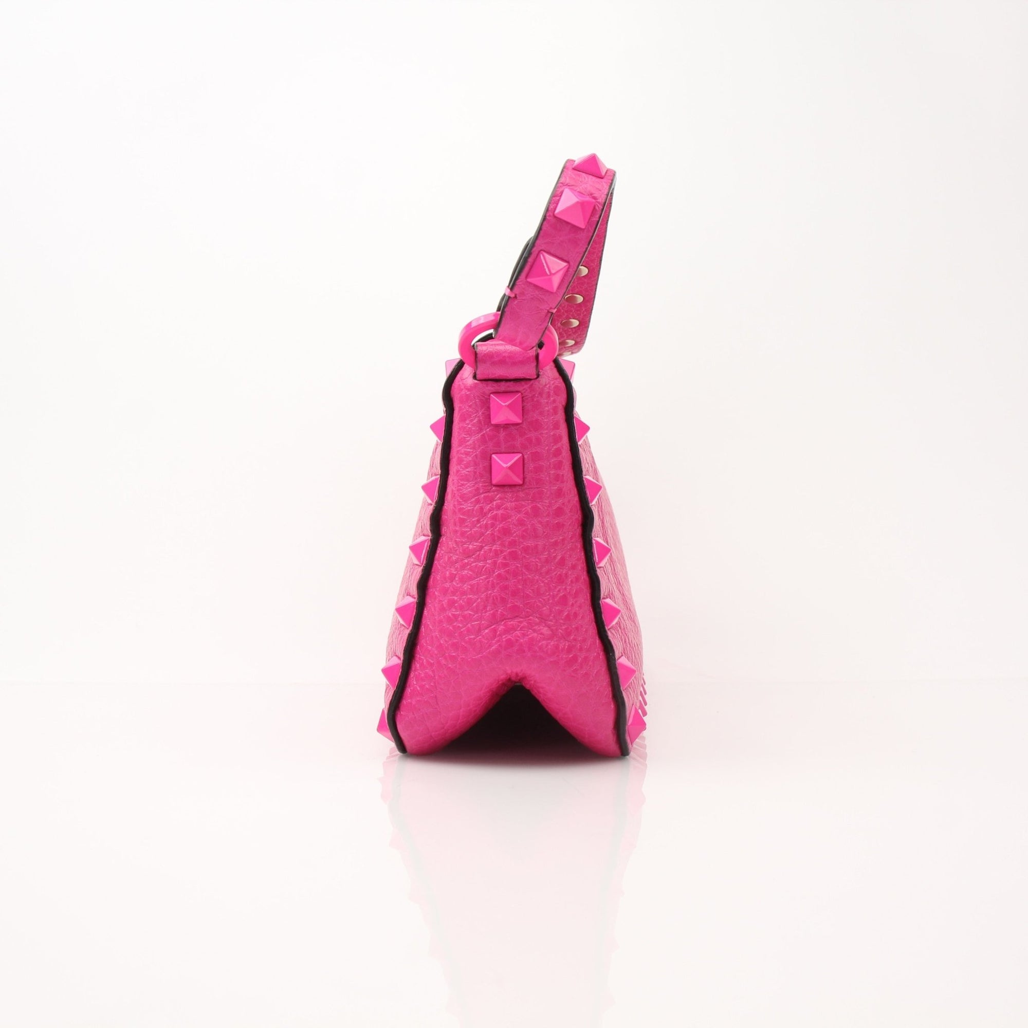 Fuchsia pink Valentino Rockstud flip lock shoulder handbag with gold accents and studded detailing, stylish and compact.