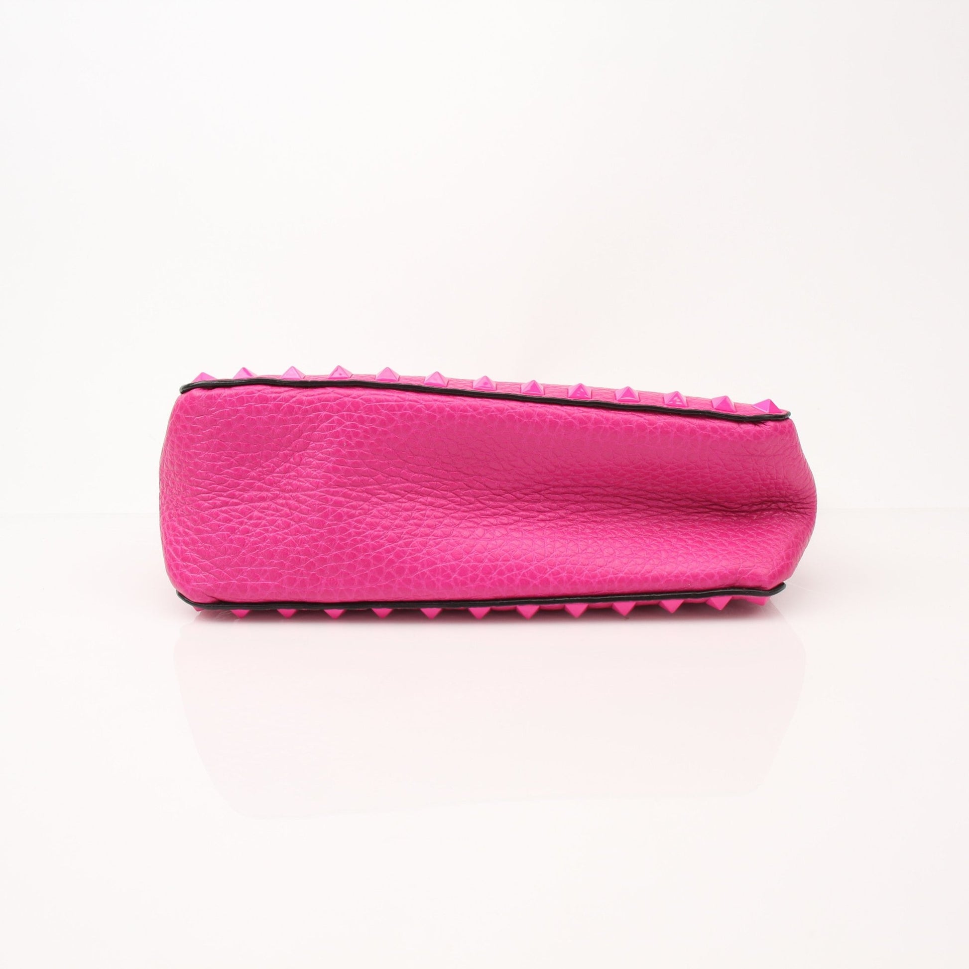 Fuchsia pink Valentino Rockstud flip lock shoulder handbag with gold chain and studded design.