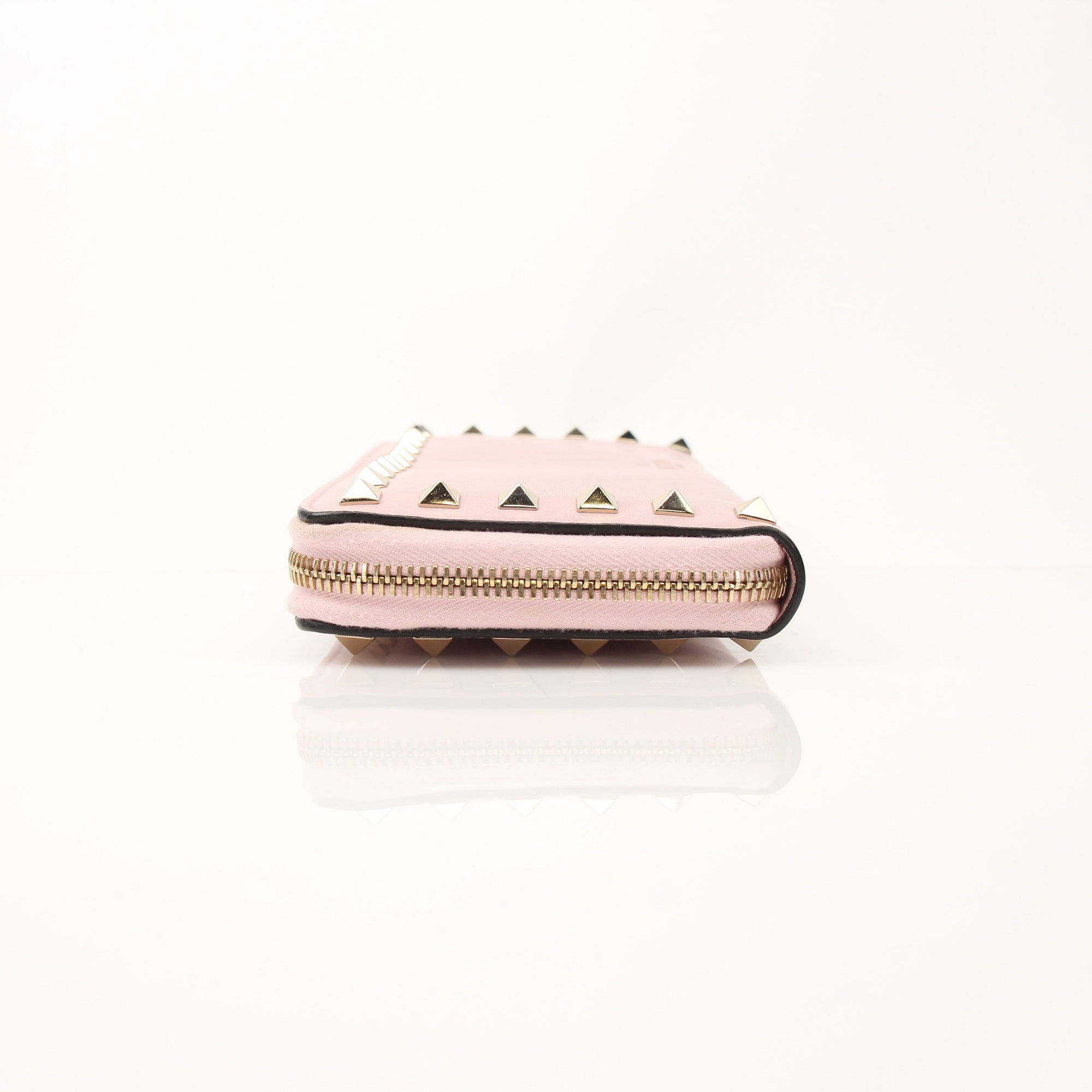Gold & Beyond Valentino Pink Rockstud zip around wallet with gold hardware and textured leather, showing the detailed design and compact size.