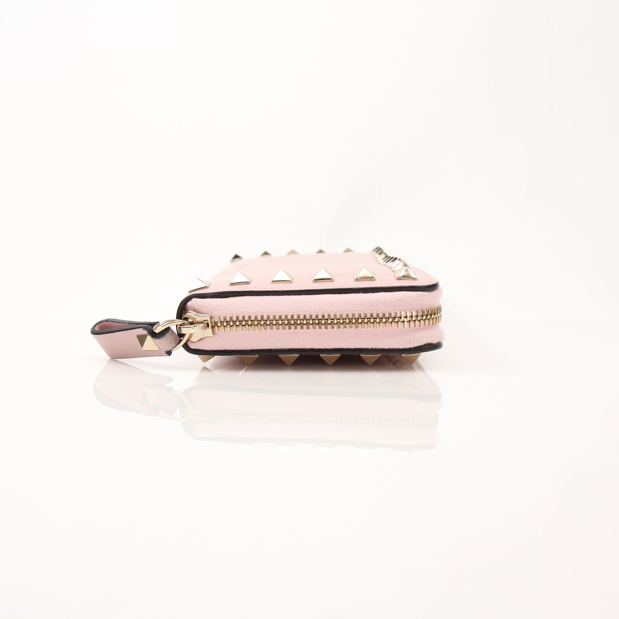 Gold & Beyond Valentino Pink Rockstud zip around wallet with signature studded design and multiple card slots.