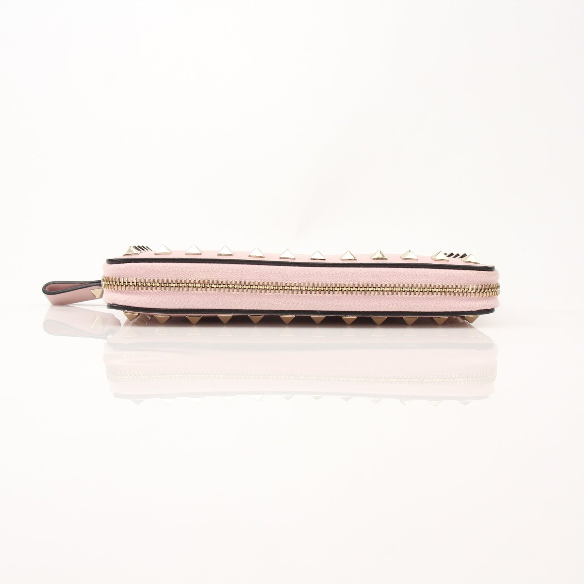 Valentino Pink Rockstud zip around wallet with gold accents and multiple card slots, designed by Gold & Beyond.