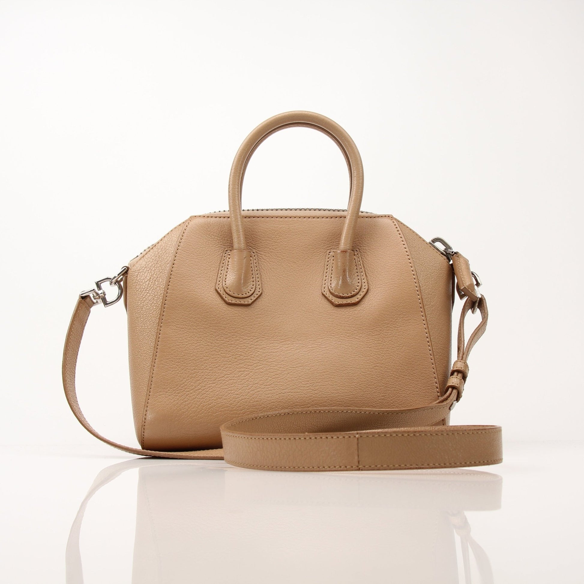 Givenchy brown Antigona mini handbag with top handle, gold accents, and structured leather design.