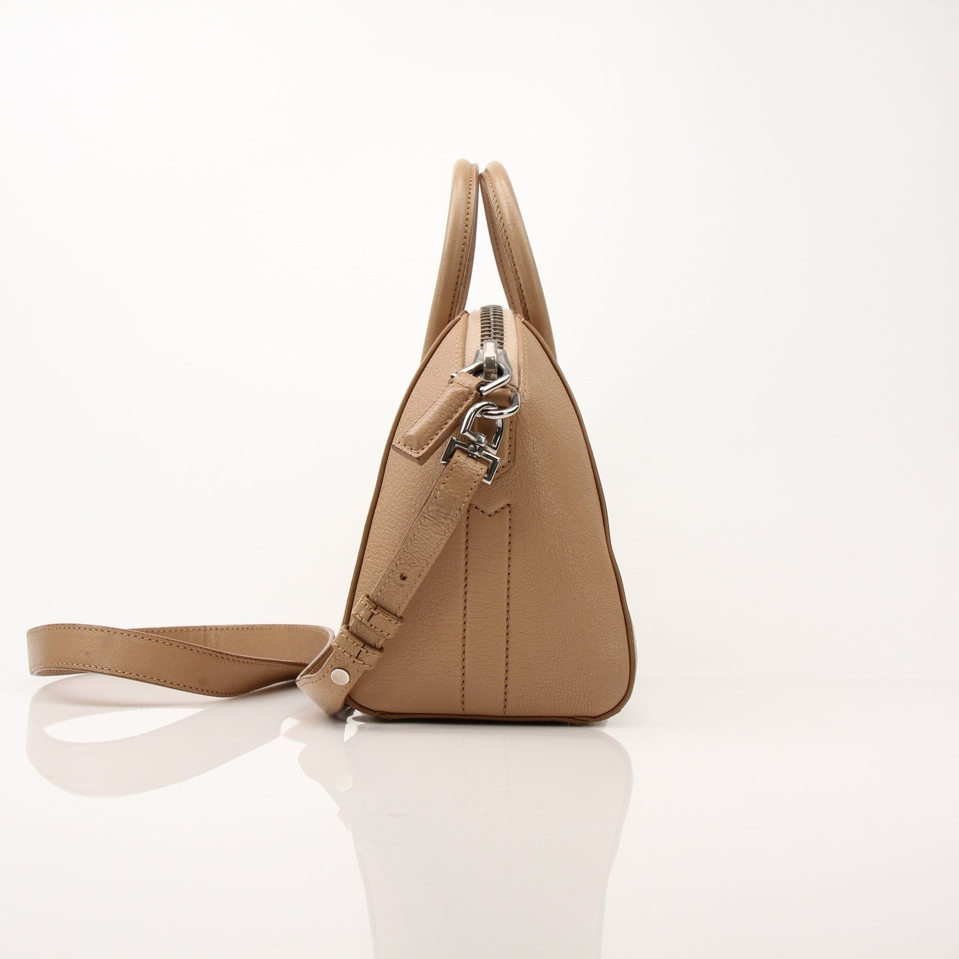 Givenchy Brown Antigona Mini Top Handle Bag, elegant handbag with top handle in a close-up shot showing texture and design details.