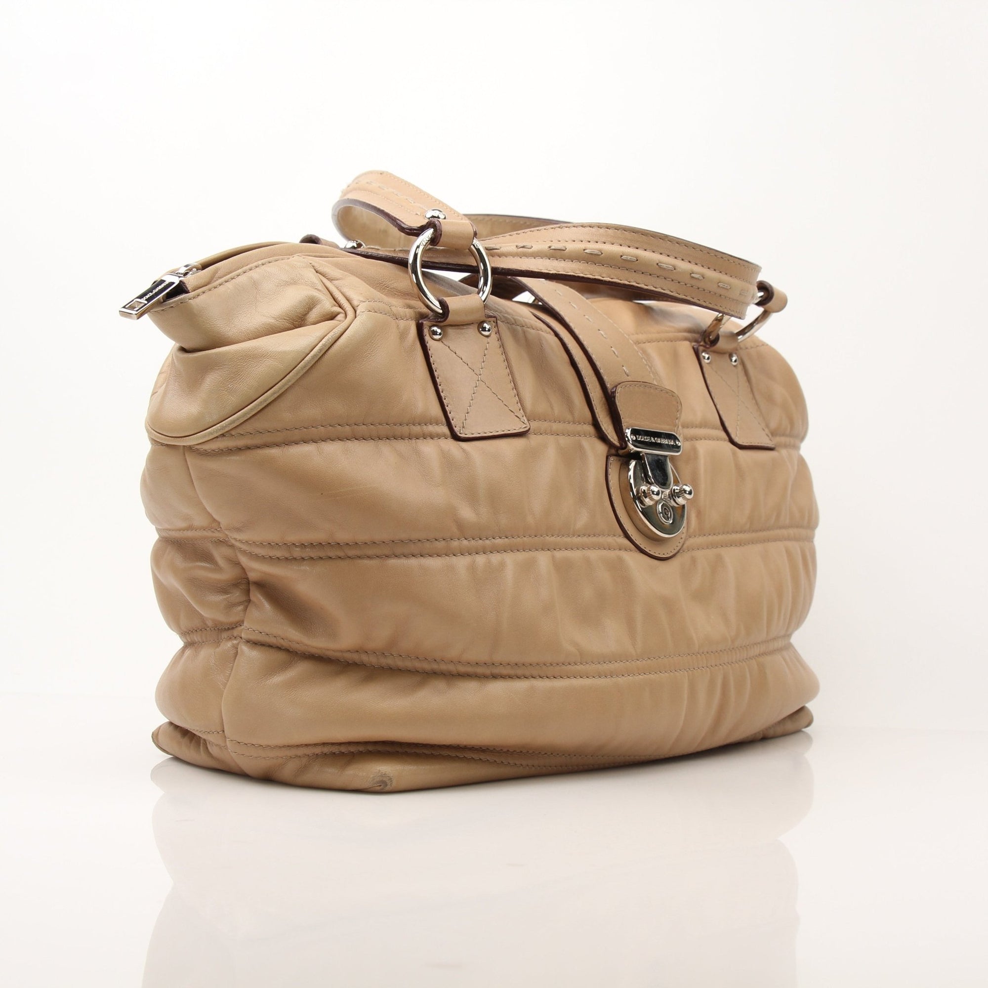 Gold & Beyond beige Dolce & Gabbana Miss Very Sexy vintage shoulder handbag with structured design and gold-tone details.