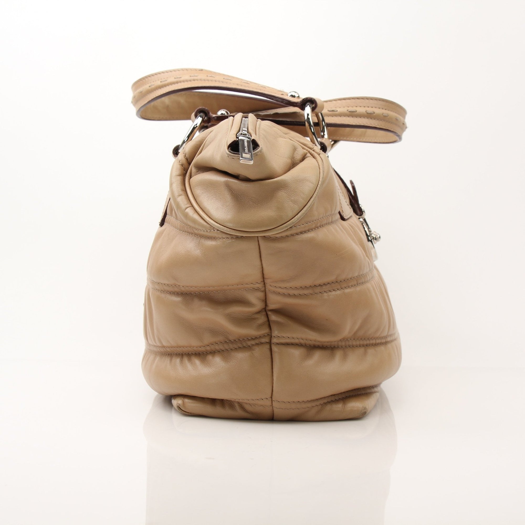 Beige Dolce & Gabbana Miss Very Sexy vintage shoulder handbag with gold accents and stylish design.