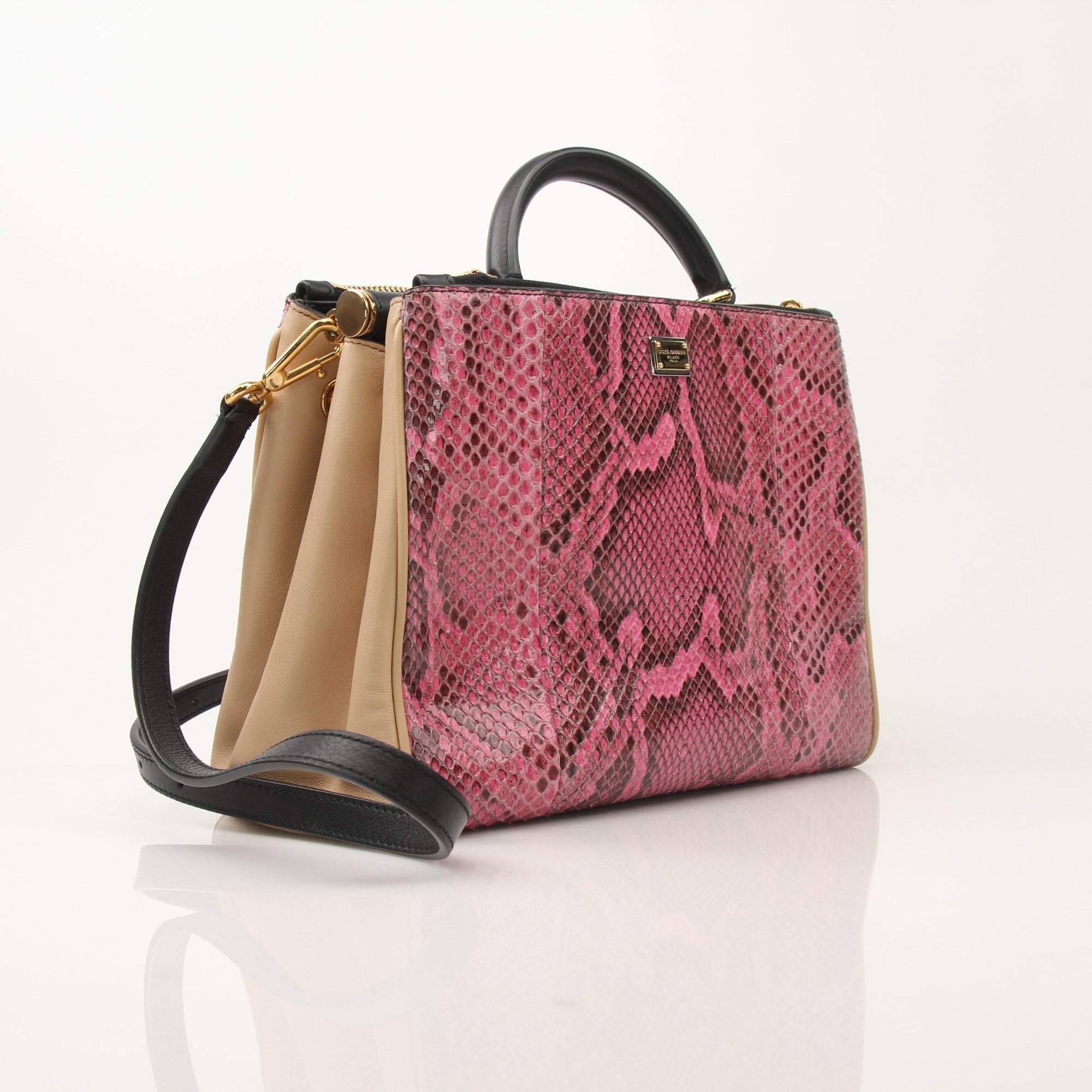 Dolce & Gabbana Miss Sicily pink python leather top handle handbag with gold accents and structured design.