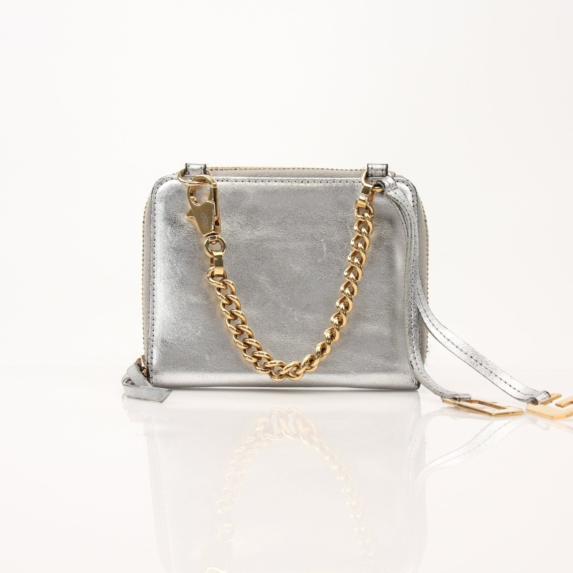 Dolce & Gabbana metallic silver zip-around wallet with sleek design and gold accents, shown open displaying interior compartments.