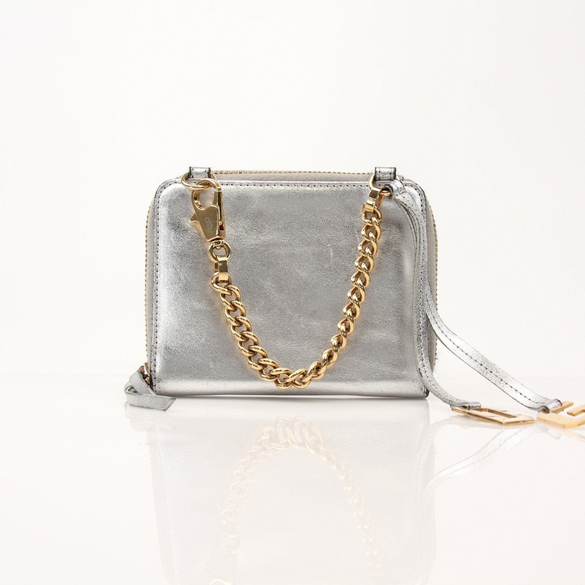 Dolce & Gabbana metallic silver zip-around wallet with sleek design and gold accents, shown open displaying interior compartments.