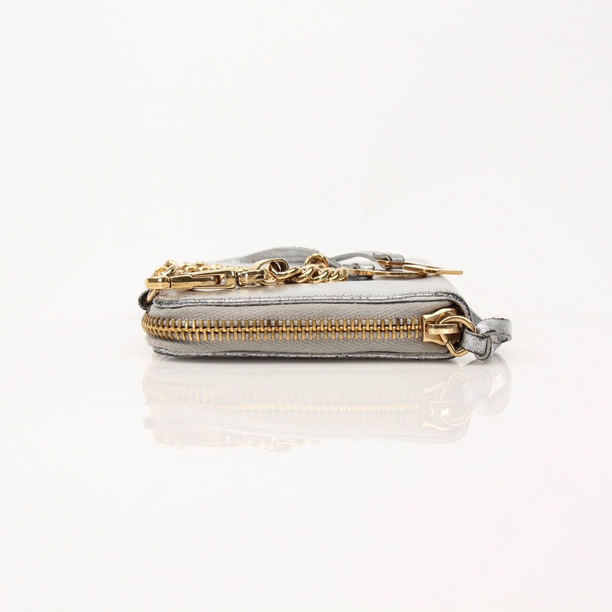 Dolce & Gabbana metallic silver zip-around wallet with gold accents, stylish leather design, and multiple card slots.