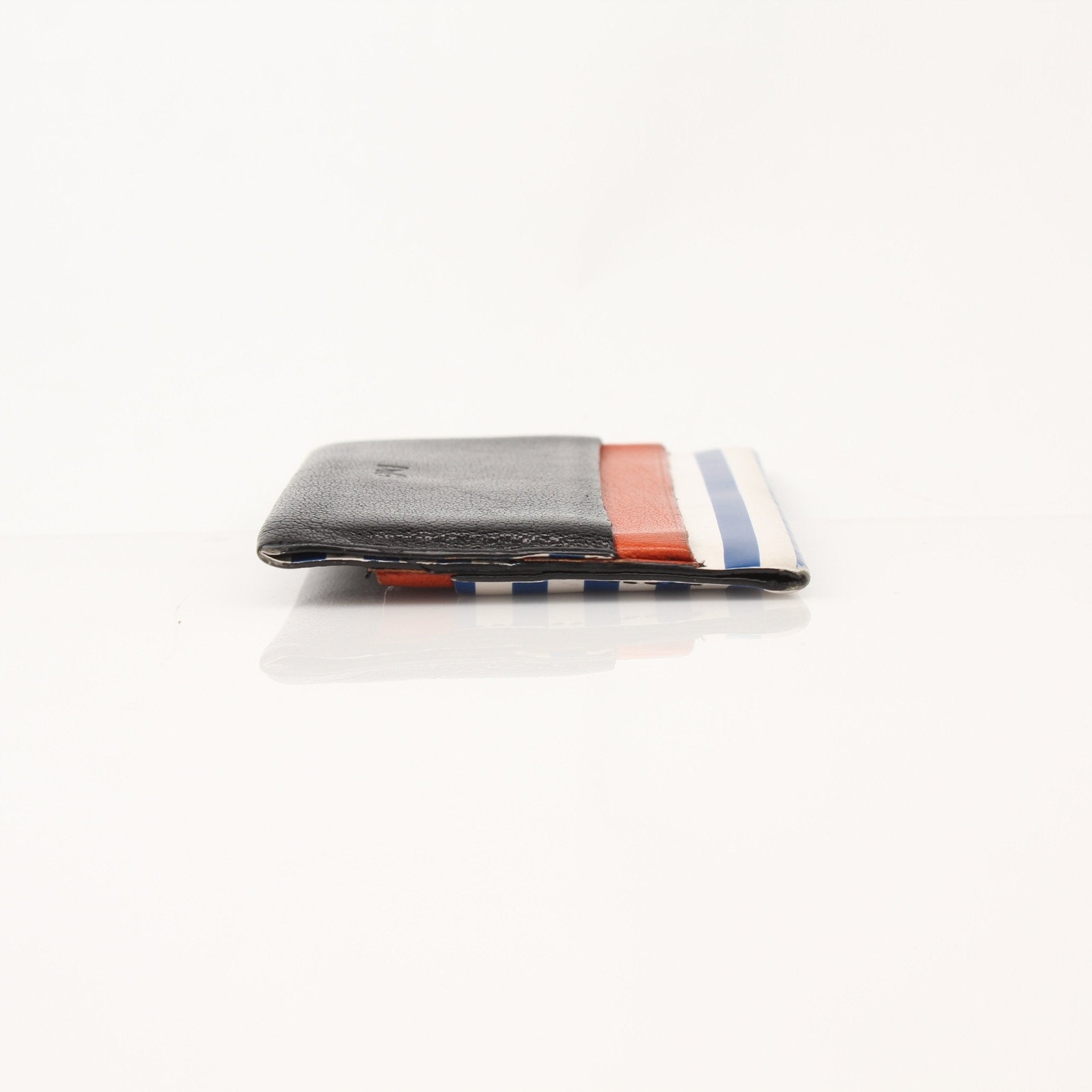 Multicolor Dolce & Gabbana cardholder with gold accents, featuring multiple card slots and a sleek, compact design.