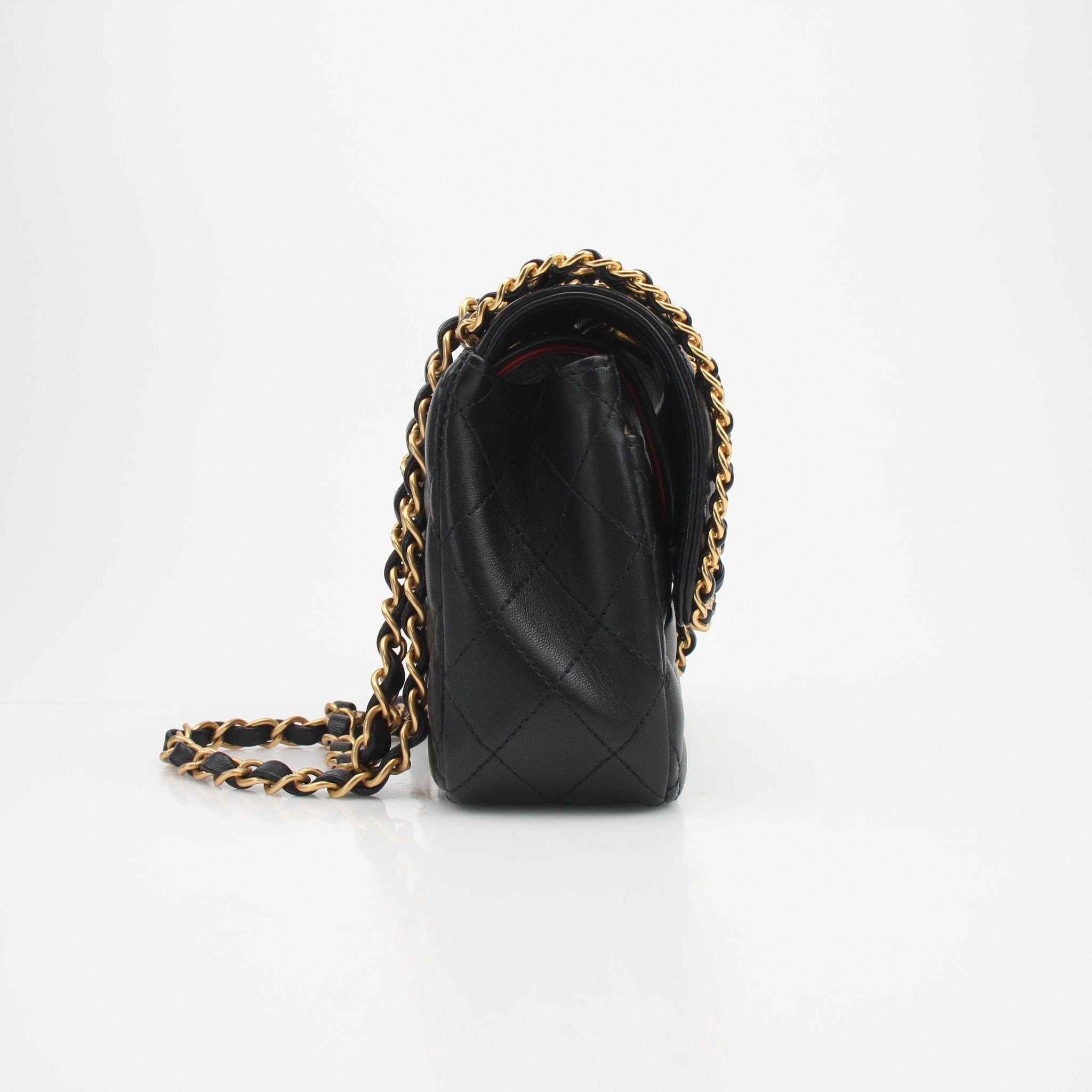 Black Chanel Timeless Classic Chained Lambskin Double Flap Bag with gold hardware, elegant handbag with signature quilting and chain strap.