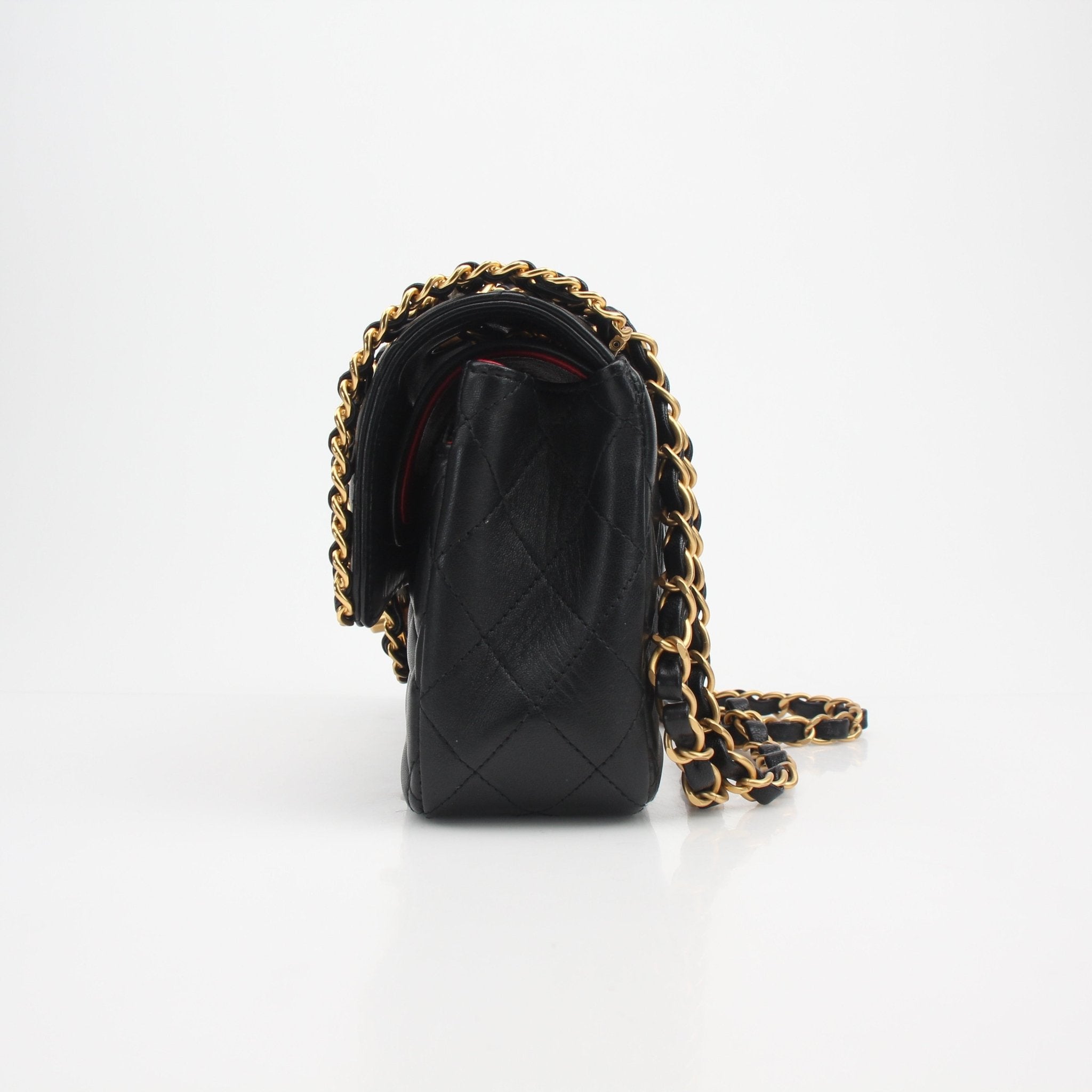 Chanel Timeless Classic Black Lambskin Double Flap Handbag with gold chain and quilting, designed by Gold & Beyond.