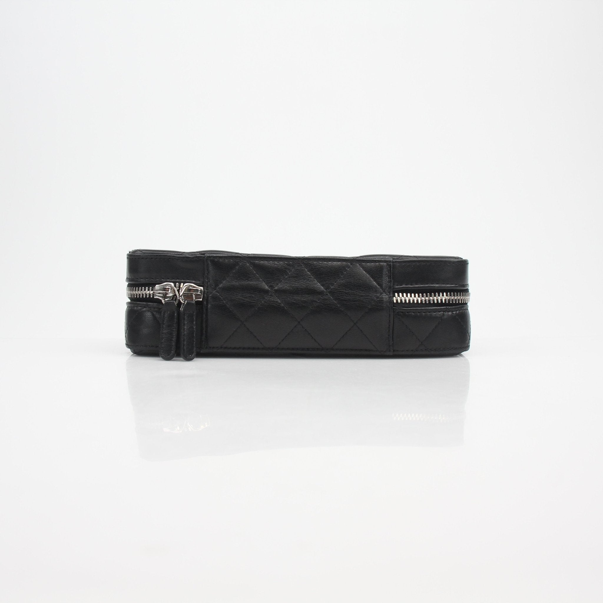 Gold & Beyond Chanel quilted lambskin vanity case with gold hardware and compact design, perfect for travel and organization.