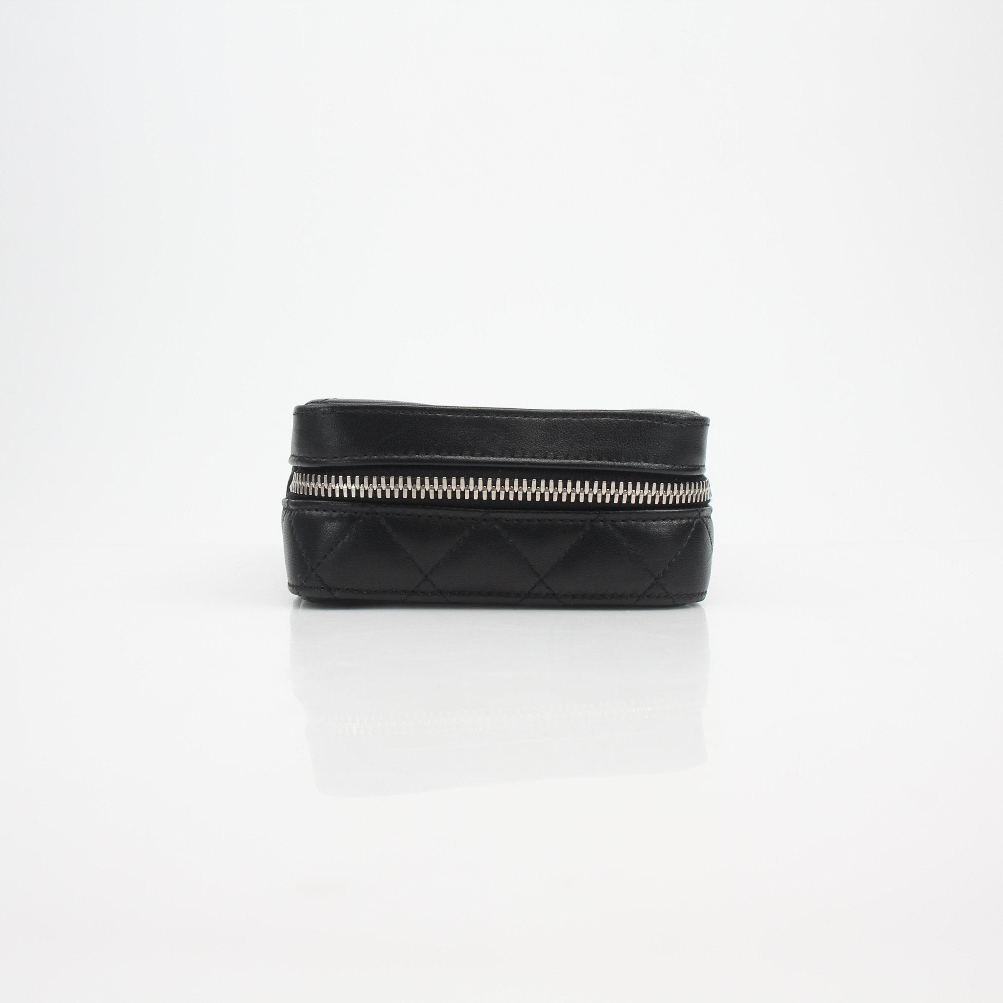 Gold & Beyond Chanel quilted lambskin vanity case with gold hardware, featuring a compact design and quilted pattern.