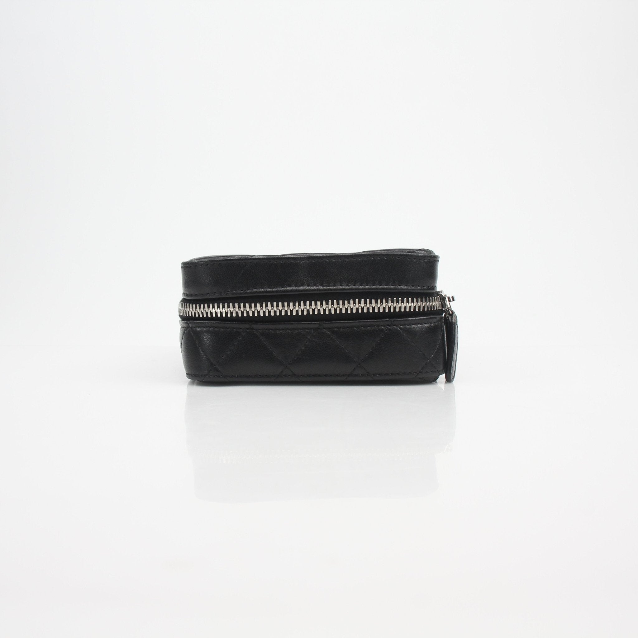 Gold & Beyond Chanel quilted lambskin vanity case with gold hardware and compact design, showcasing luxurious craftsmanship.