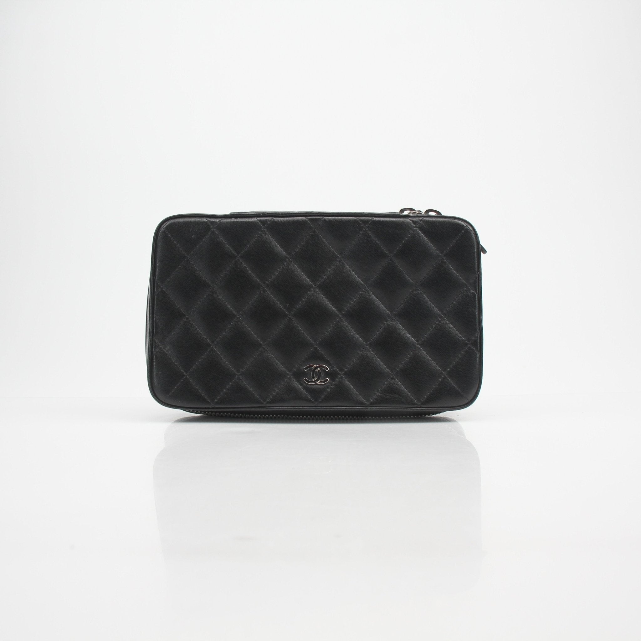 Gold & Beyond Chanel quilted lambskin vanity case with gold hardware and compact design, perfect for travel and storage.
