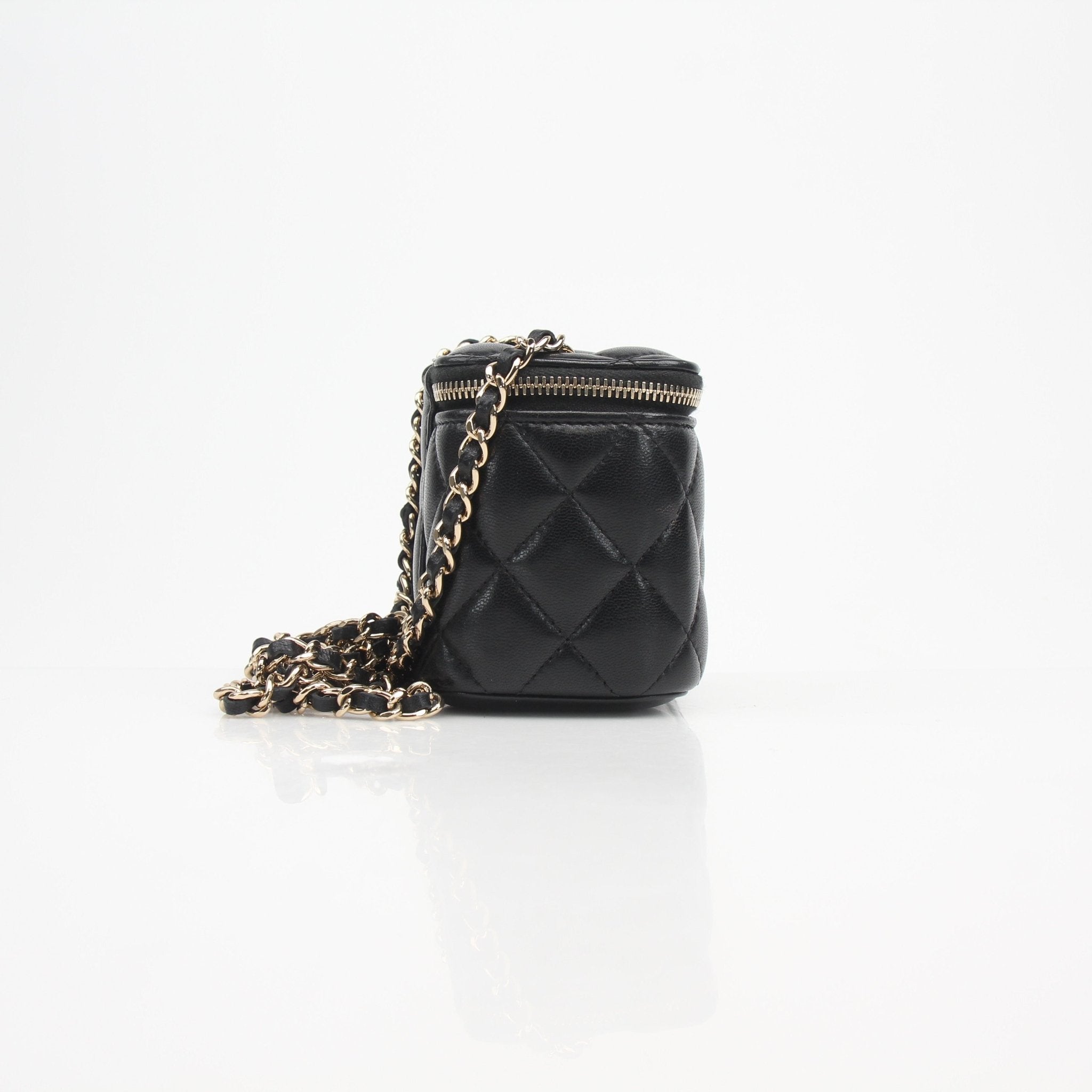 Gold & Beyond Chanel mini quilted lambskin vanity case with chain, featuring a compact, luxurious design and gold-tone hardware.