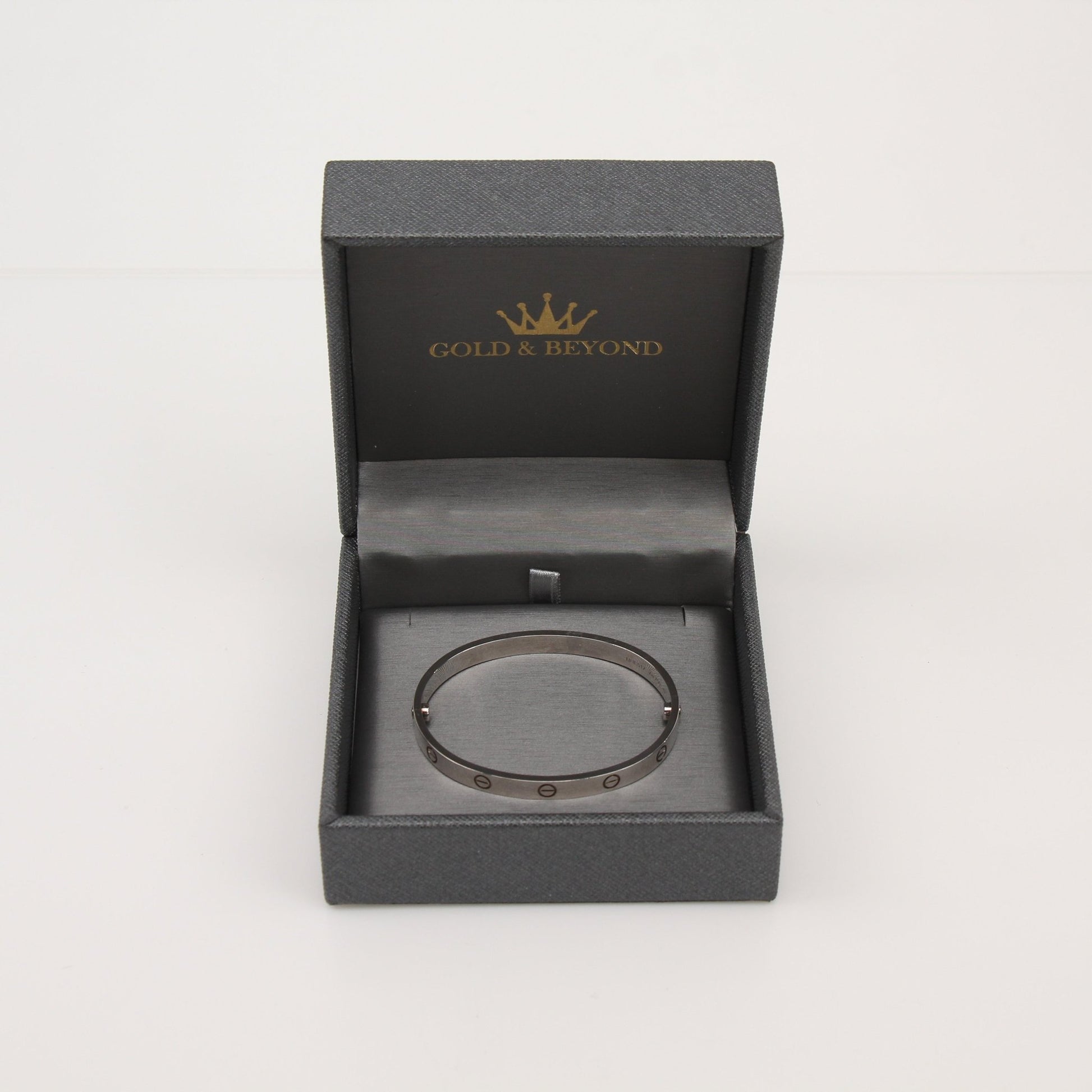 Gold & Beyond Cartier Love Bracelet jewelry with signature screw motifs on polished gold band.