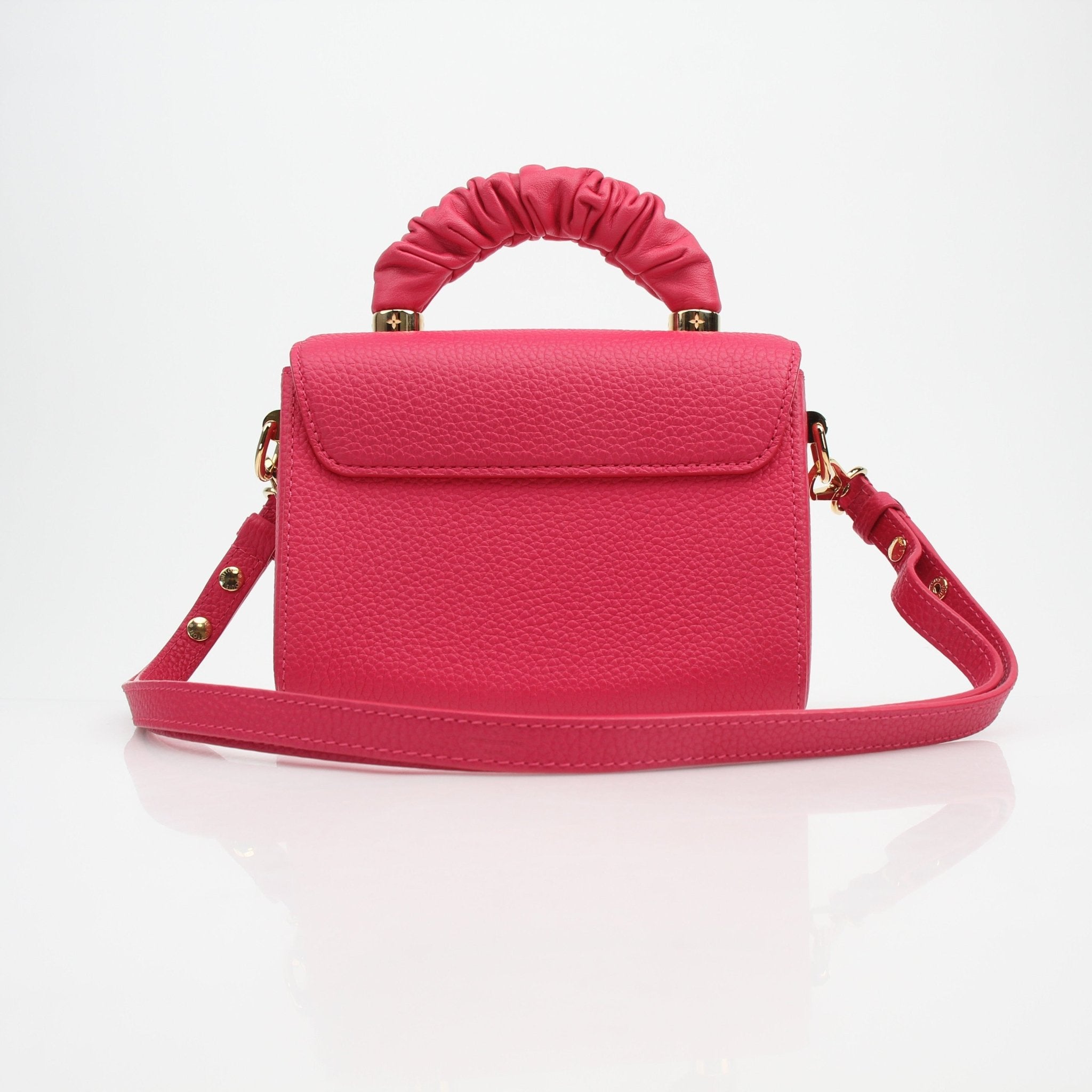 Louis Vuitton Twist One Handle PM handbag in Pondichéry Pink Taurillon leather, featuring gold hardware and elegant design.