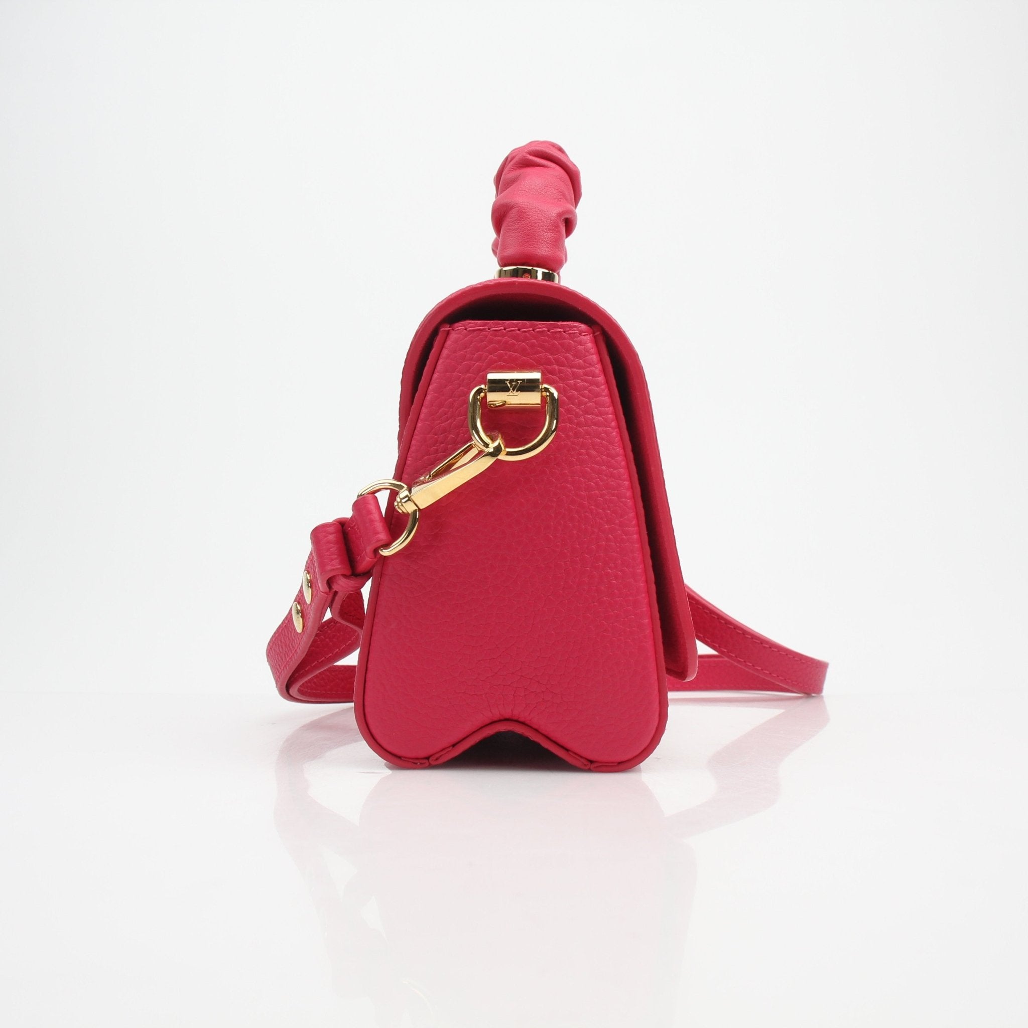 Louis Vuitton Twist One Handle PM handbag in Pondichéry Pink Taurillon leather with gold hardware, showcasing elegant craftsmanship.