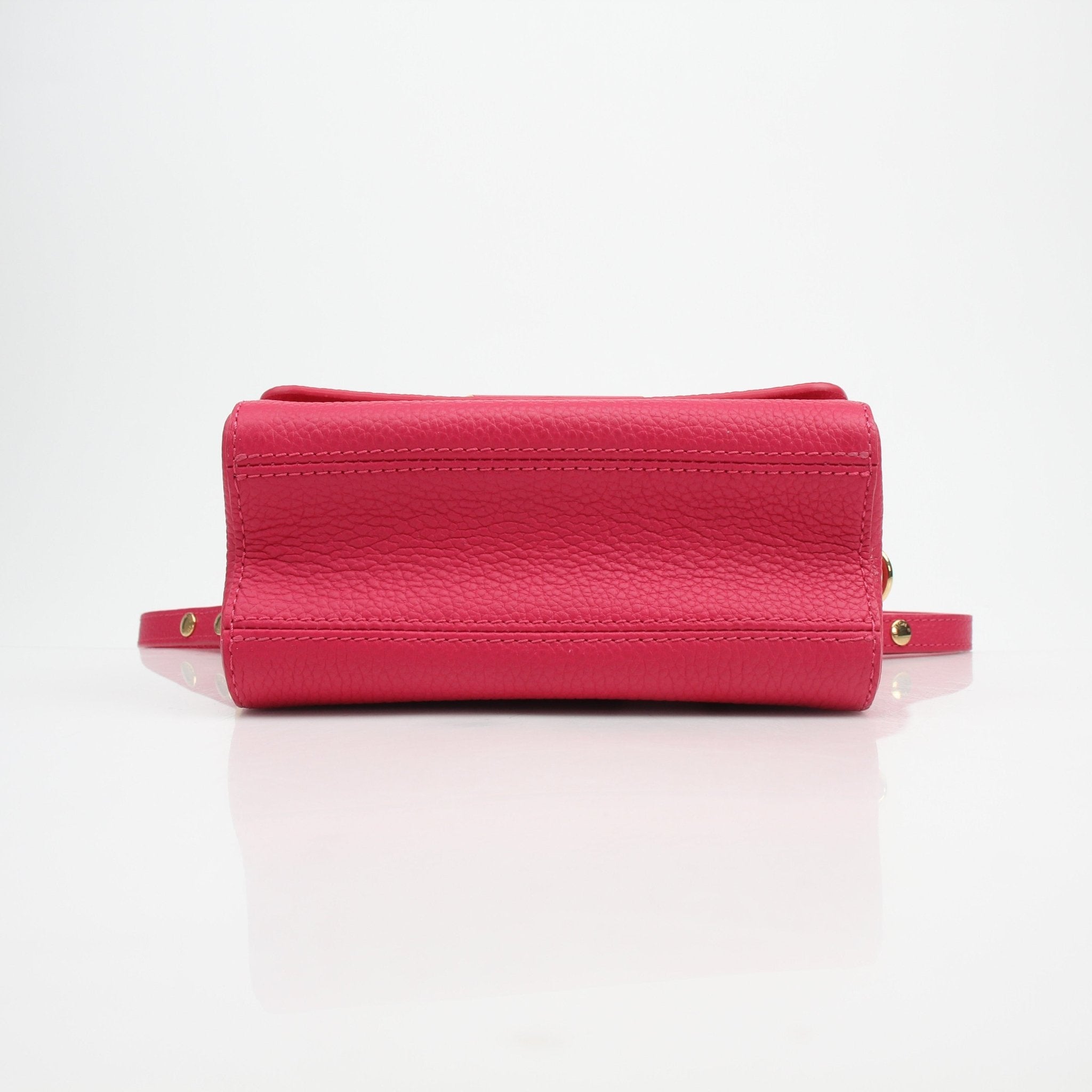 Louis Vuitton Twist One Handle PM handbag in Pondichéry Pink Taurillon leather with gold hardware, featuring a structured design and top handle.