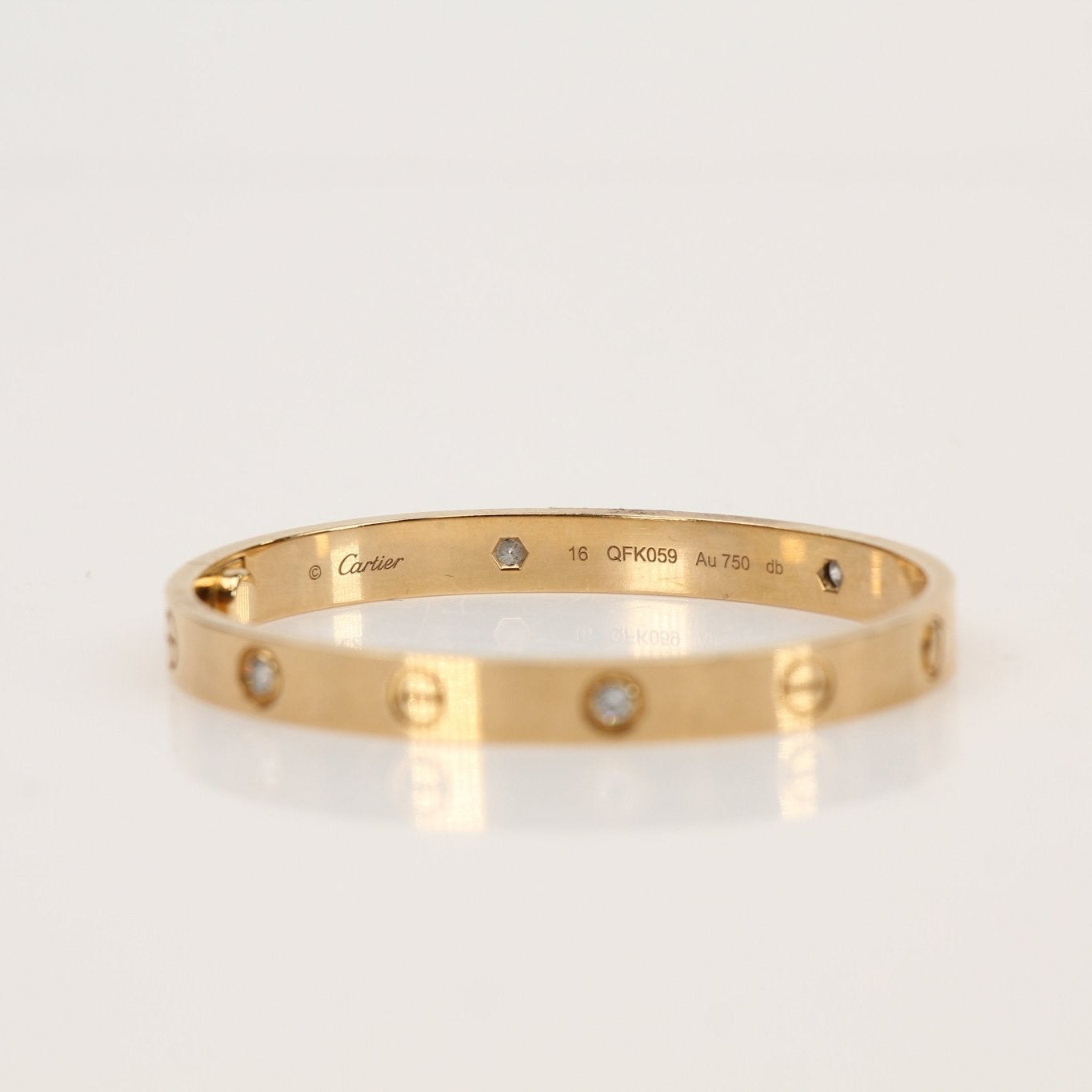 Cartier Diamond Love Cuff Bracelet jewelry with sparkling diamonds and gold finish, stylish and elegant accessory.