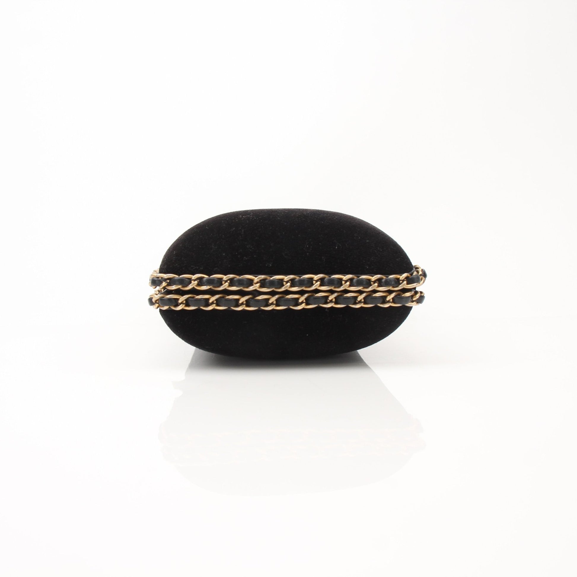Chanel black velour CC chain-around evening clutch handbag with gold accents and elegant design.