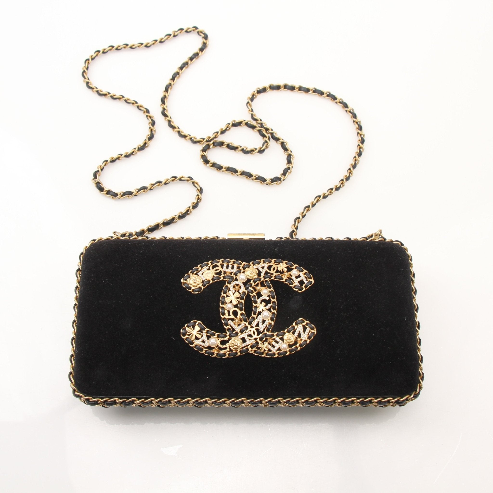 Chanel black velour CC chain around evening clutch handbag with gold accents and elegant design.