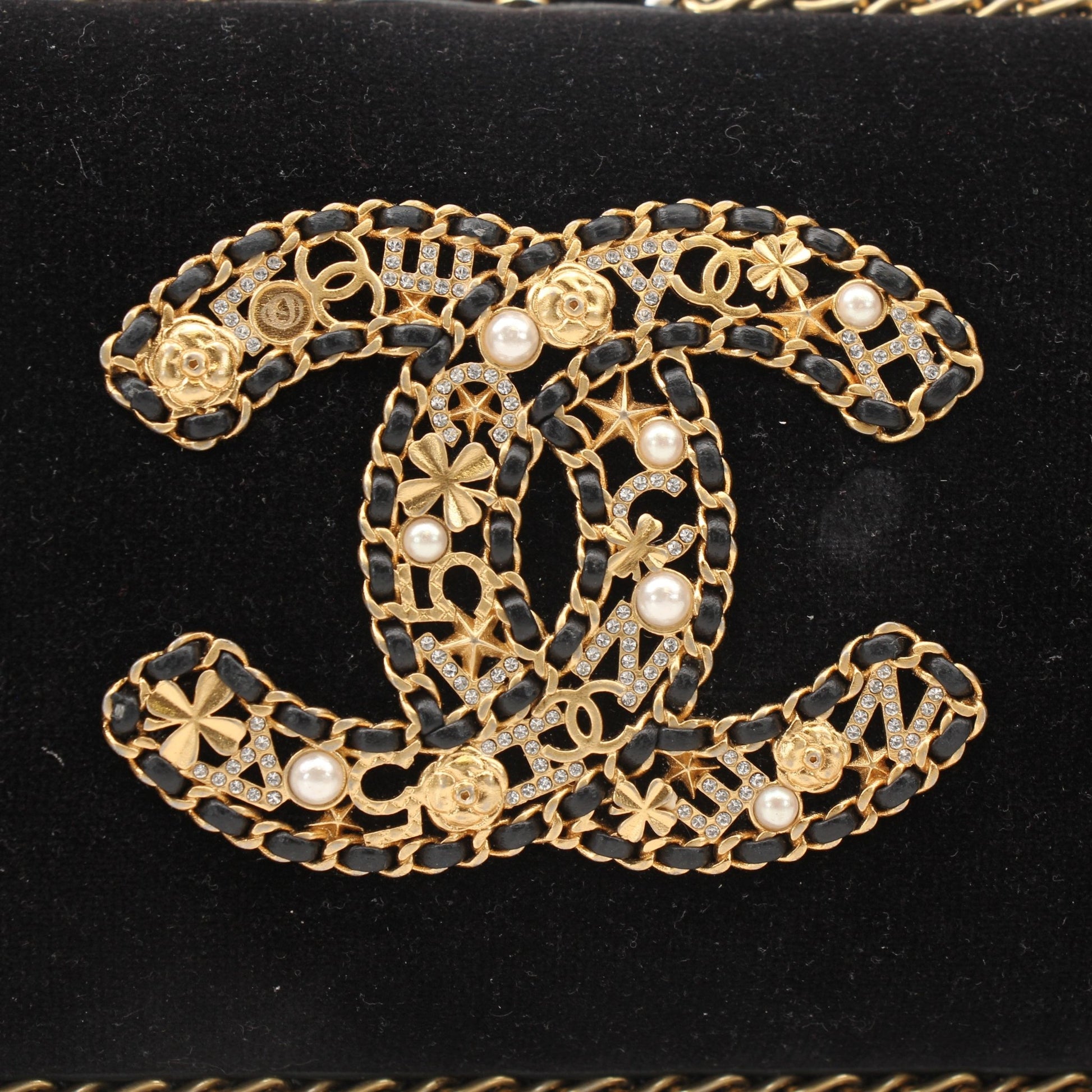 Chanel black velour CC chain evening clutch handbag with gold hardware and elegant design.