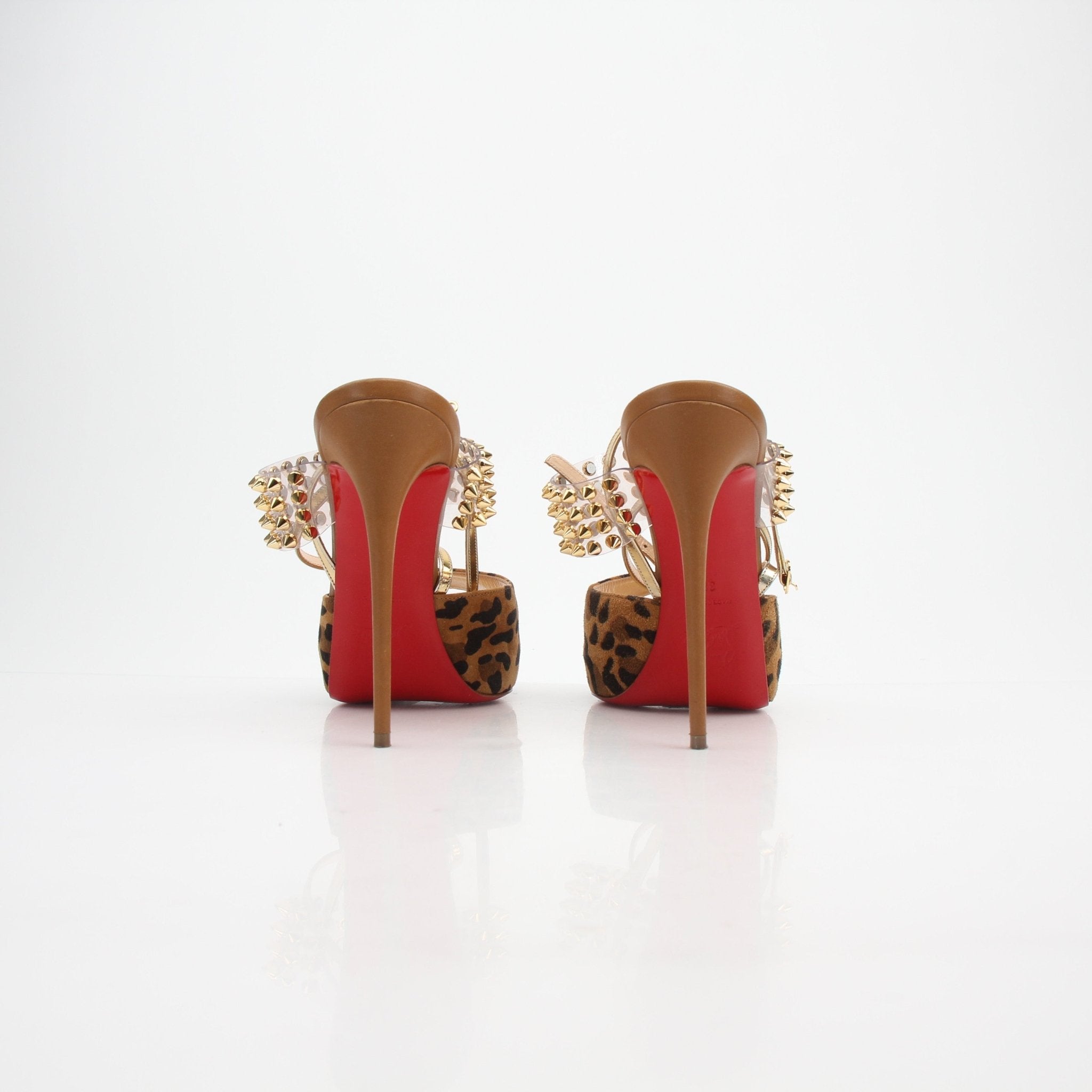 Christian Louboutin Levitagirl 120 platform sandals in gold with signature red sole and ankle strap, displayed on a neutral background.