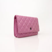 Gold & Beyond light purple Chanel wallet on chain, showing the stylish wallet with chain strap and elegant design.