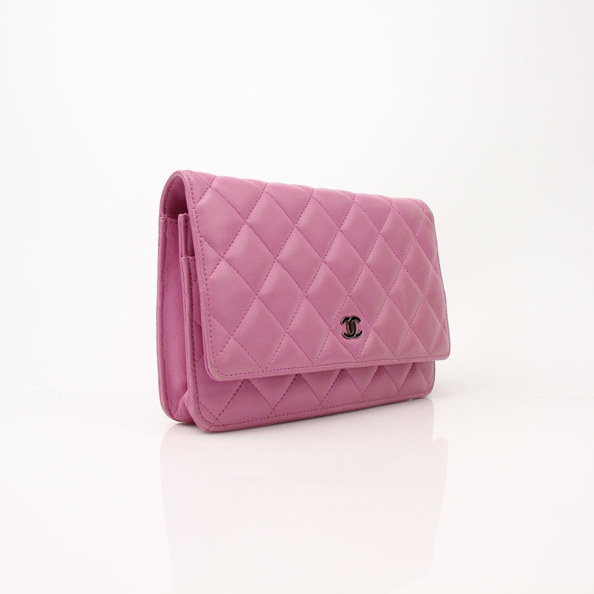 Gold & Beyond light purple Chanel wallet on chain, showing the stylish wallet with chain strap and elegant design.